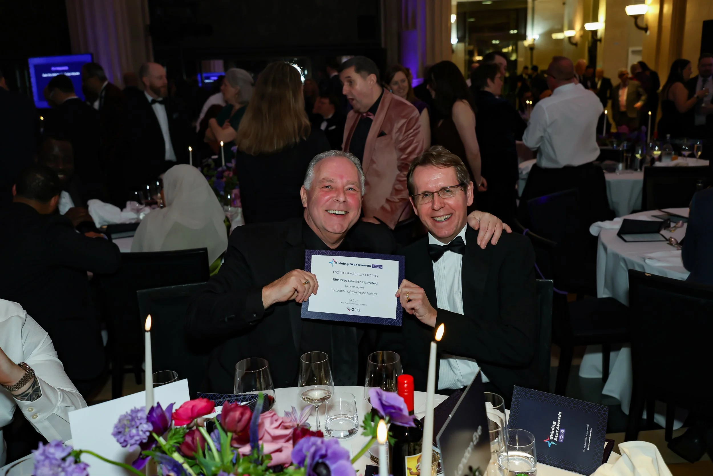 Corporate employees enjoys the camaraderie during event reception. 