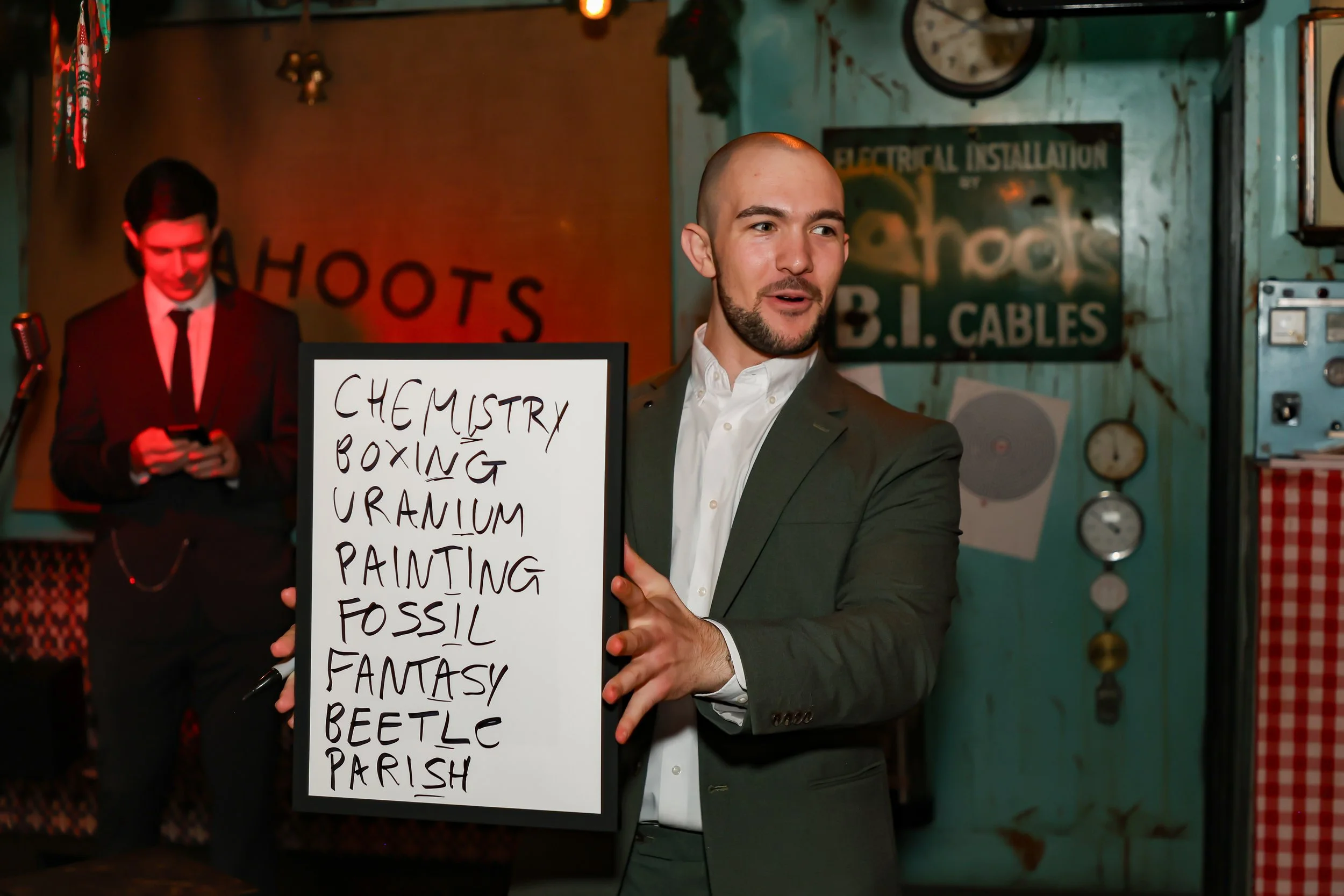Professional magician displaying the outcome of audience involvement at a corporate reception.