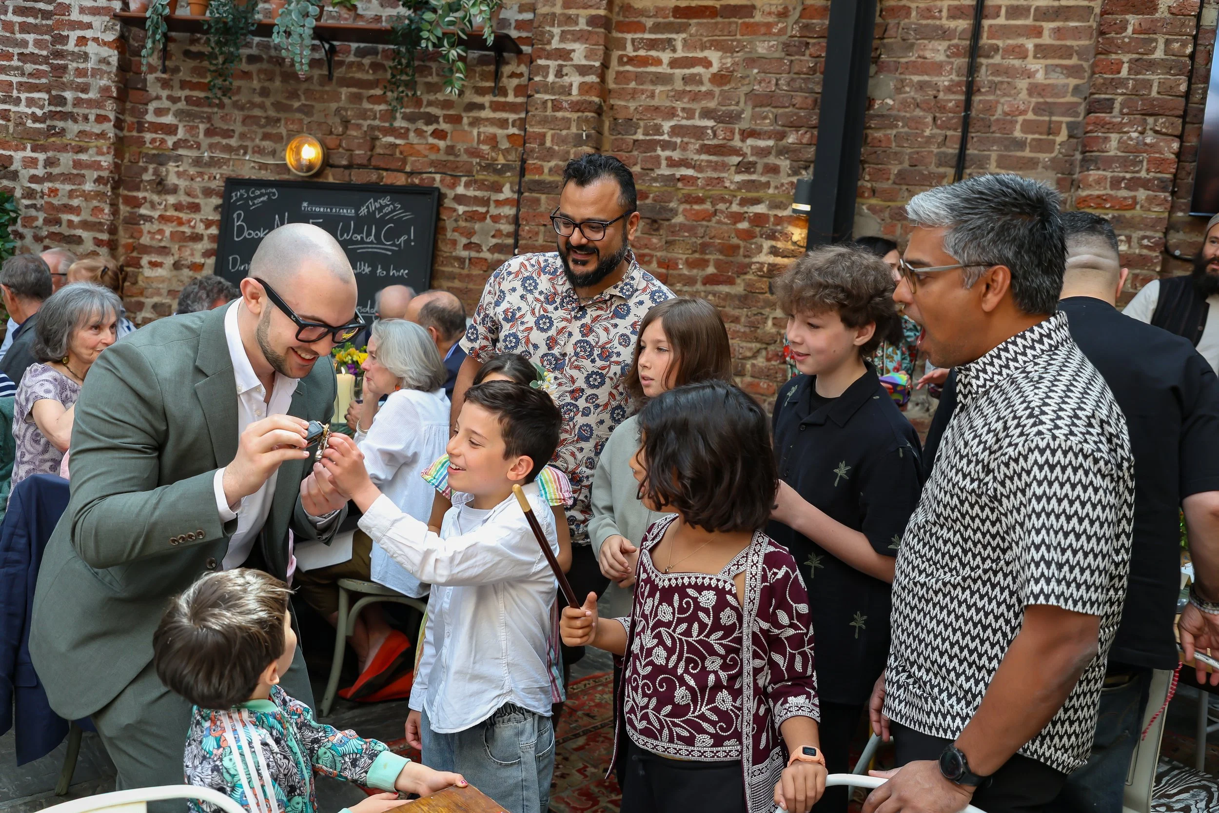 Kids love the moment with the Magician. 2026-May 3 Rhoda & Baruch Golden Wedding Anniversary. 