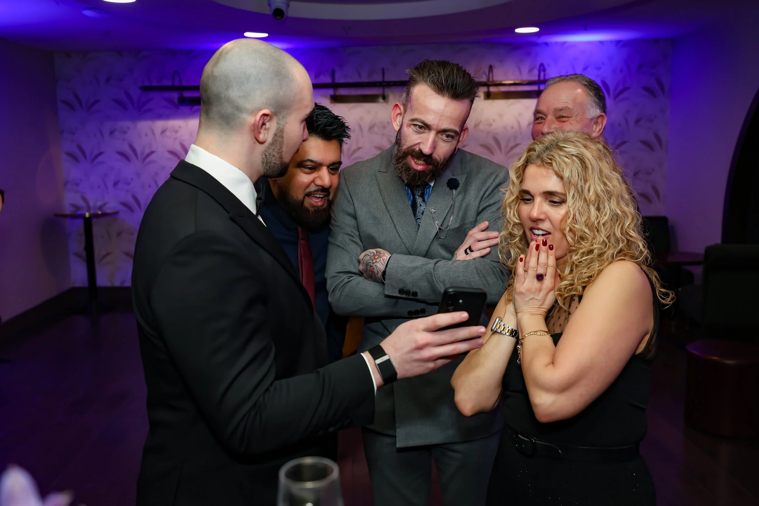 Guests were amazed by the magic trick during corporate reception. 