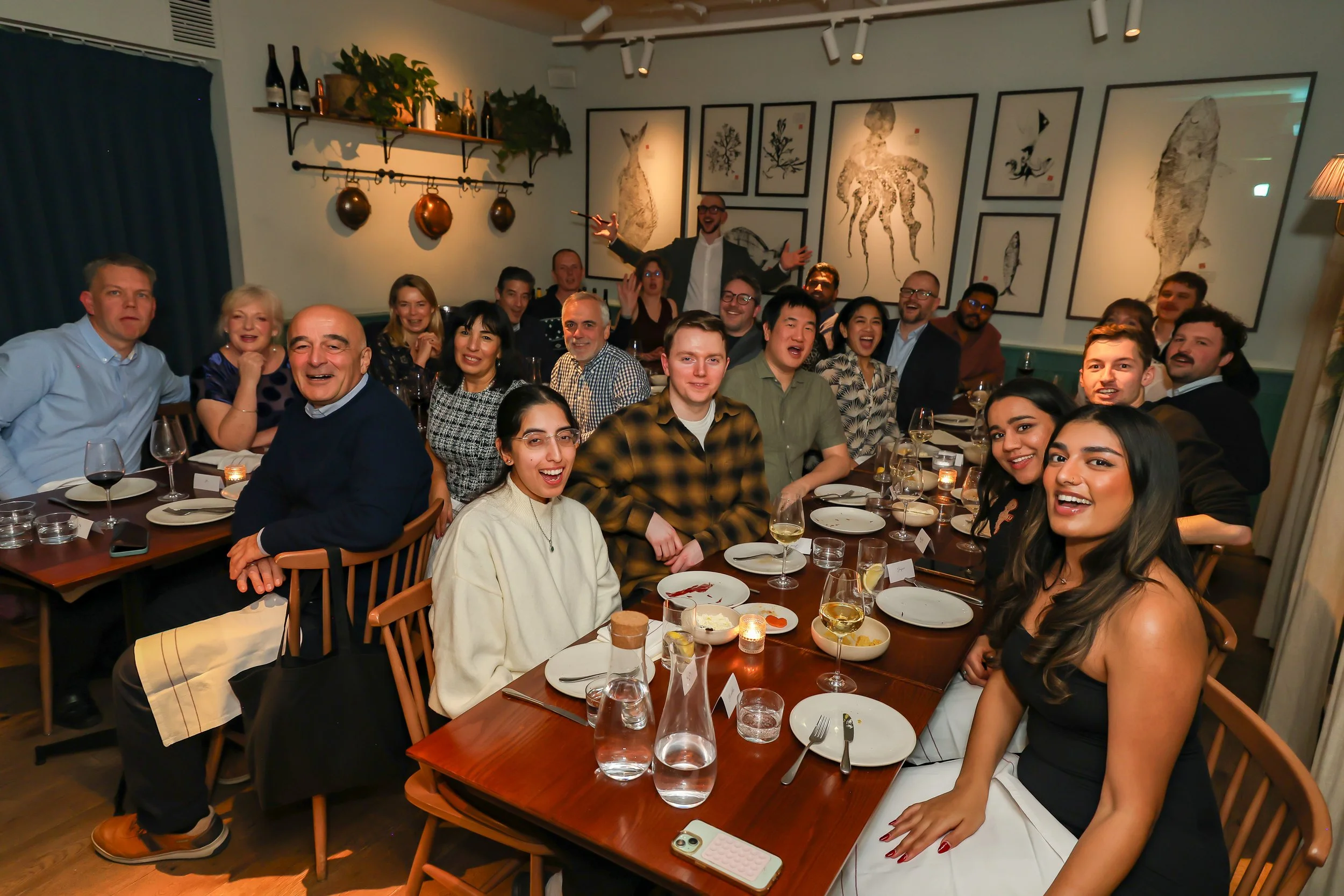 Corporate magician with the guests during dinner reception.