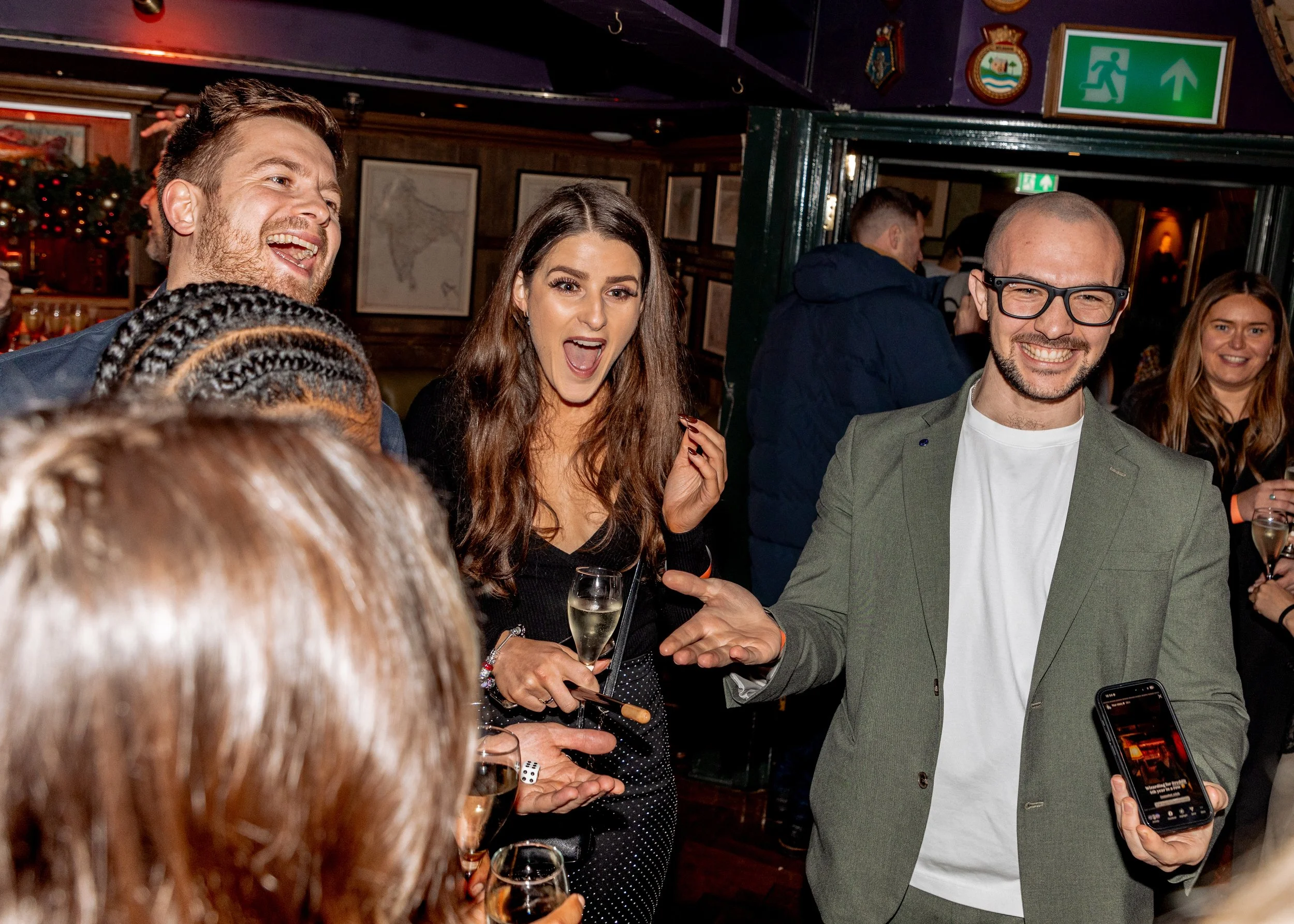 Live magic performance bringing smiles to corporate Christmas guests.