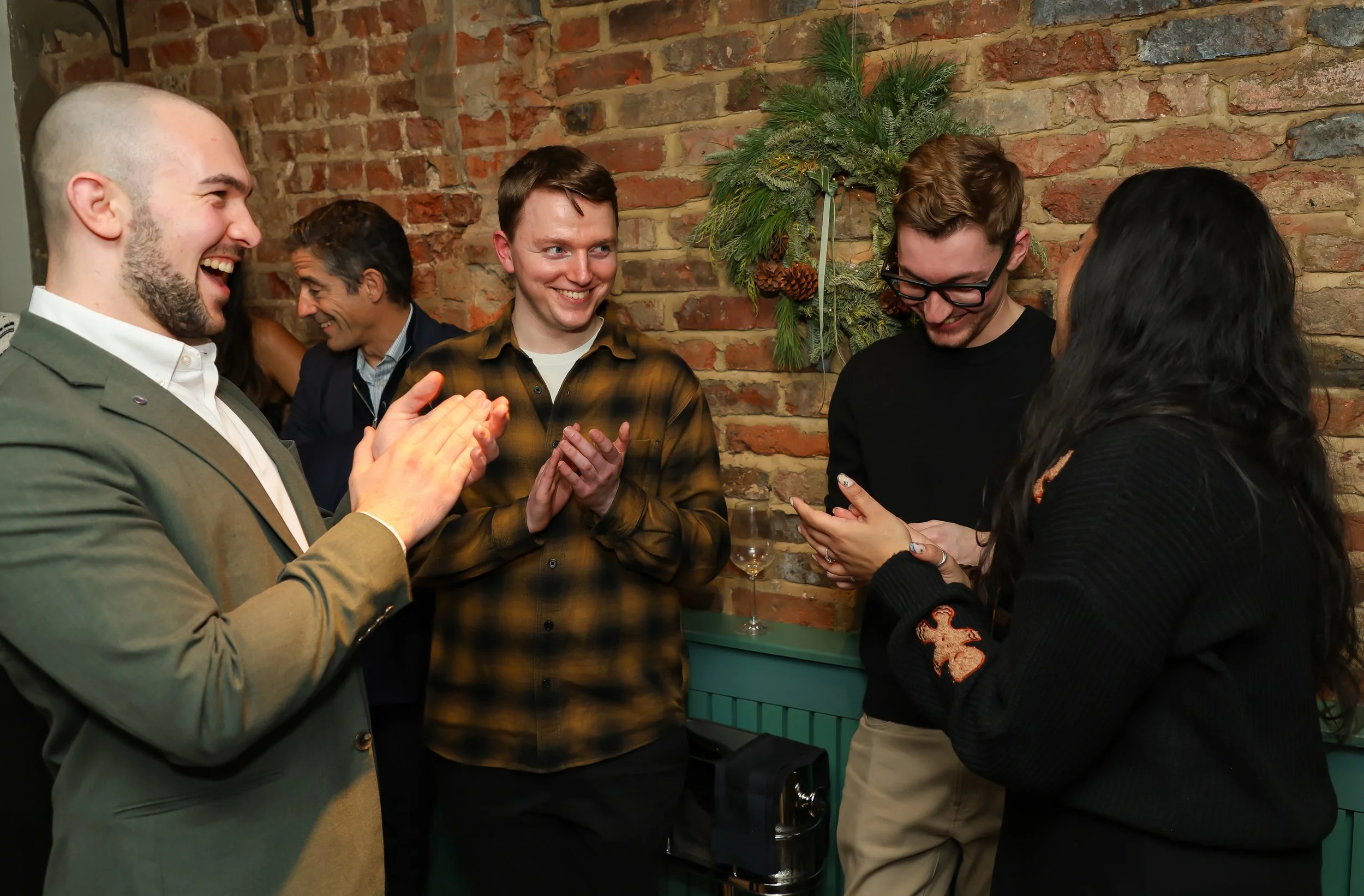 Small-group interactive magic creating moments of laughter and surprise for guests.