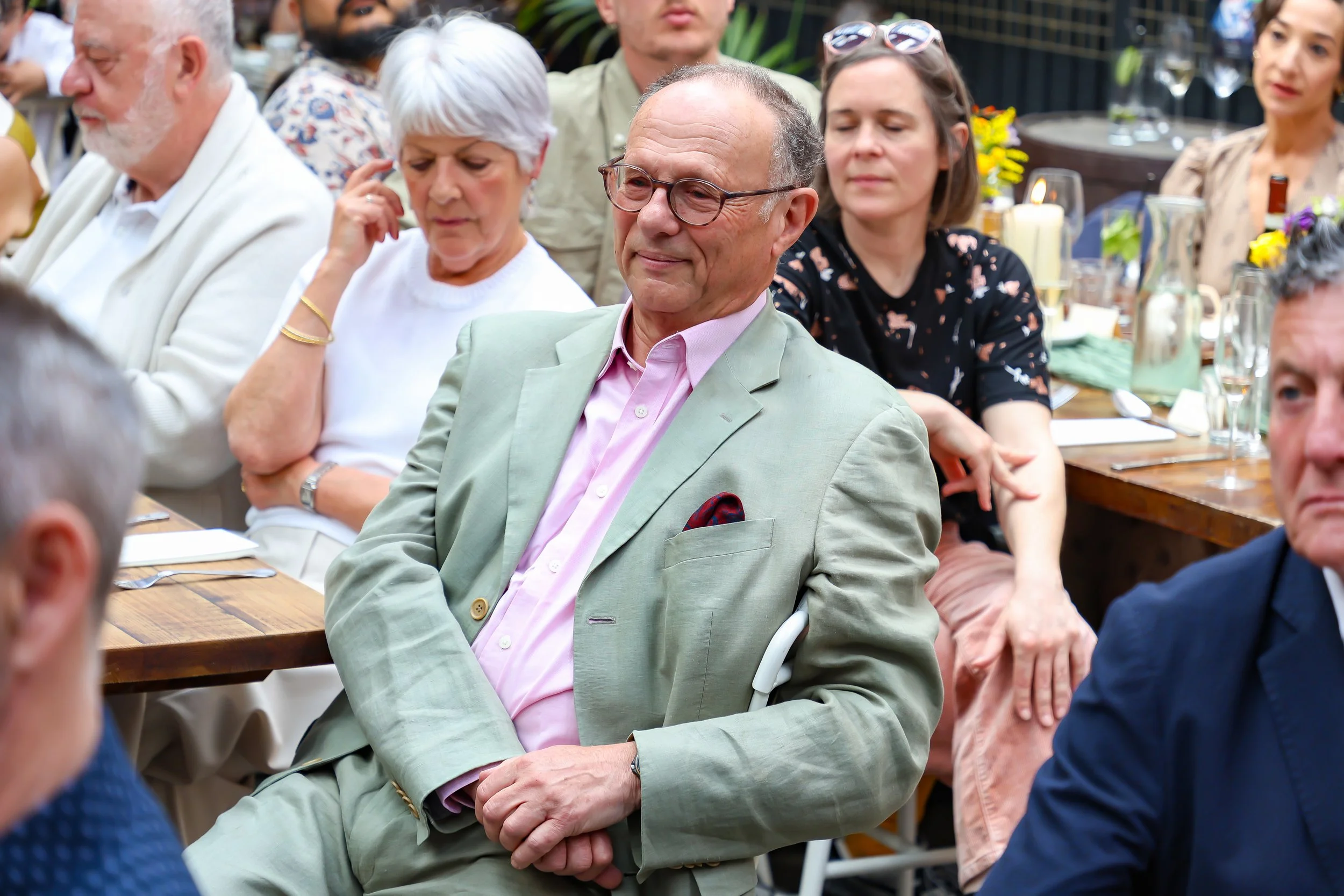 Listens attentively to Baruch on 2026-May 3 Rhoda & Baruch 50th Wedding Anniversary.