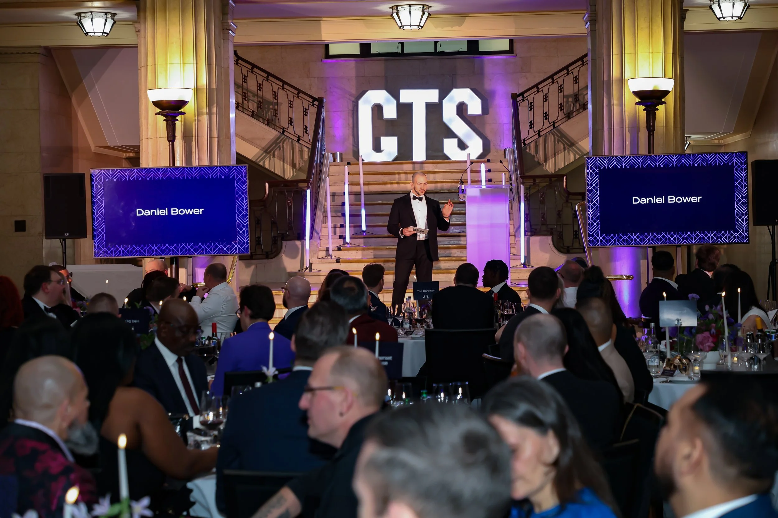 A polished event host & magician leading the flow effortlessly, maintaining momentum and a lively atmosphere throughout.