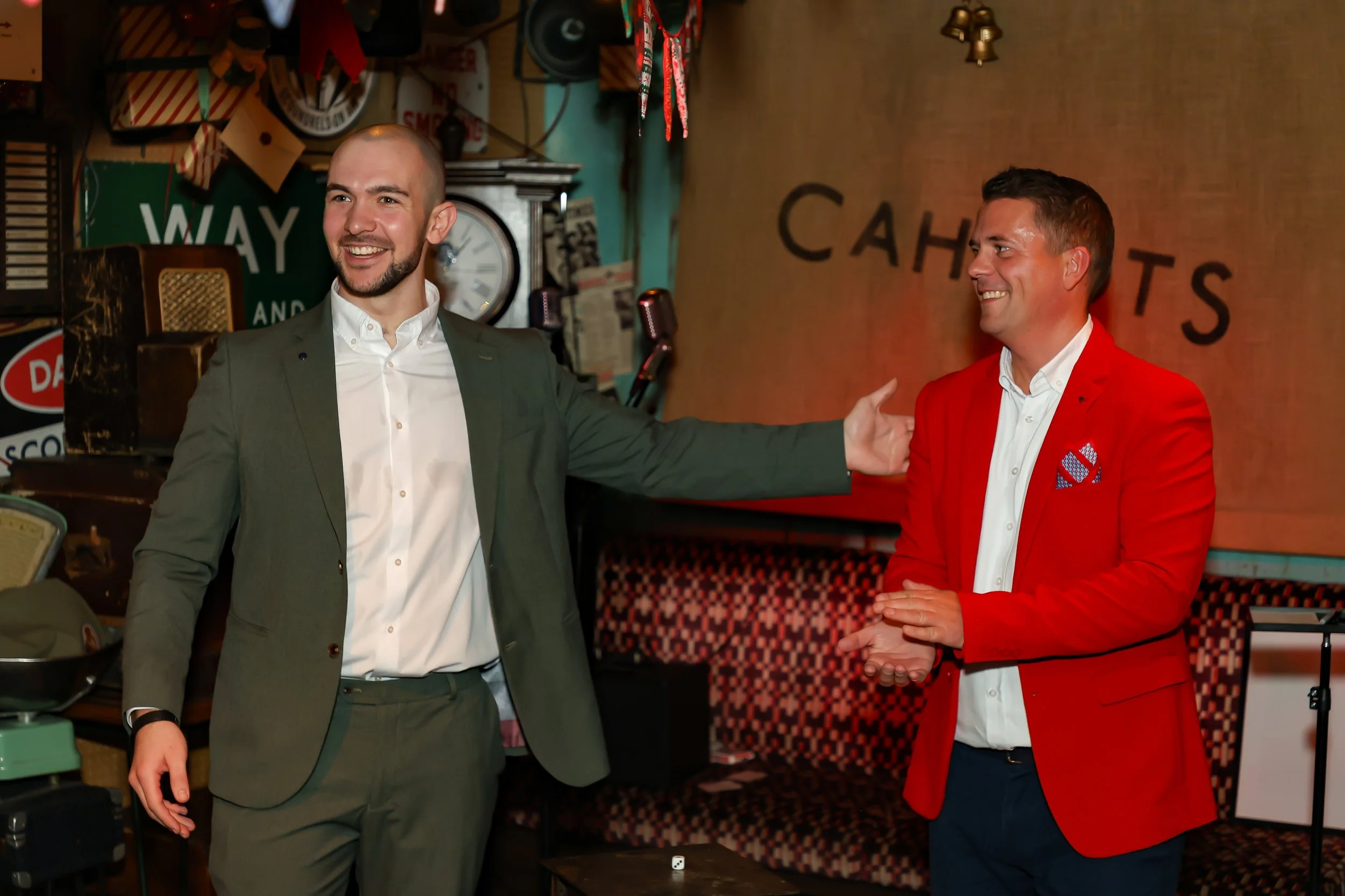 Guest actively involved in an interactive magic show during the event.
