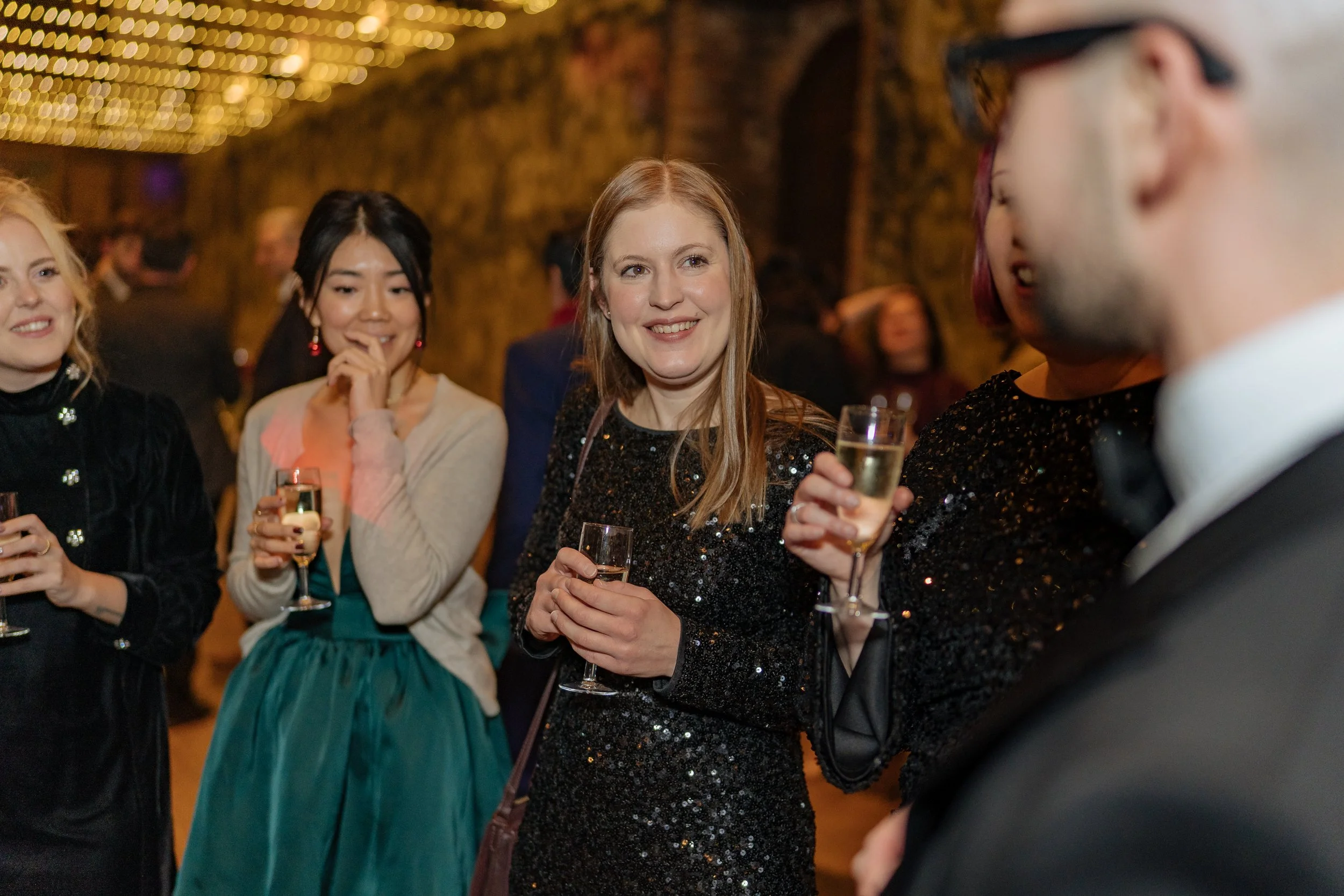 Corporate guests enjoying close-up magic during a formal corporate event.