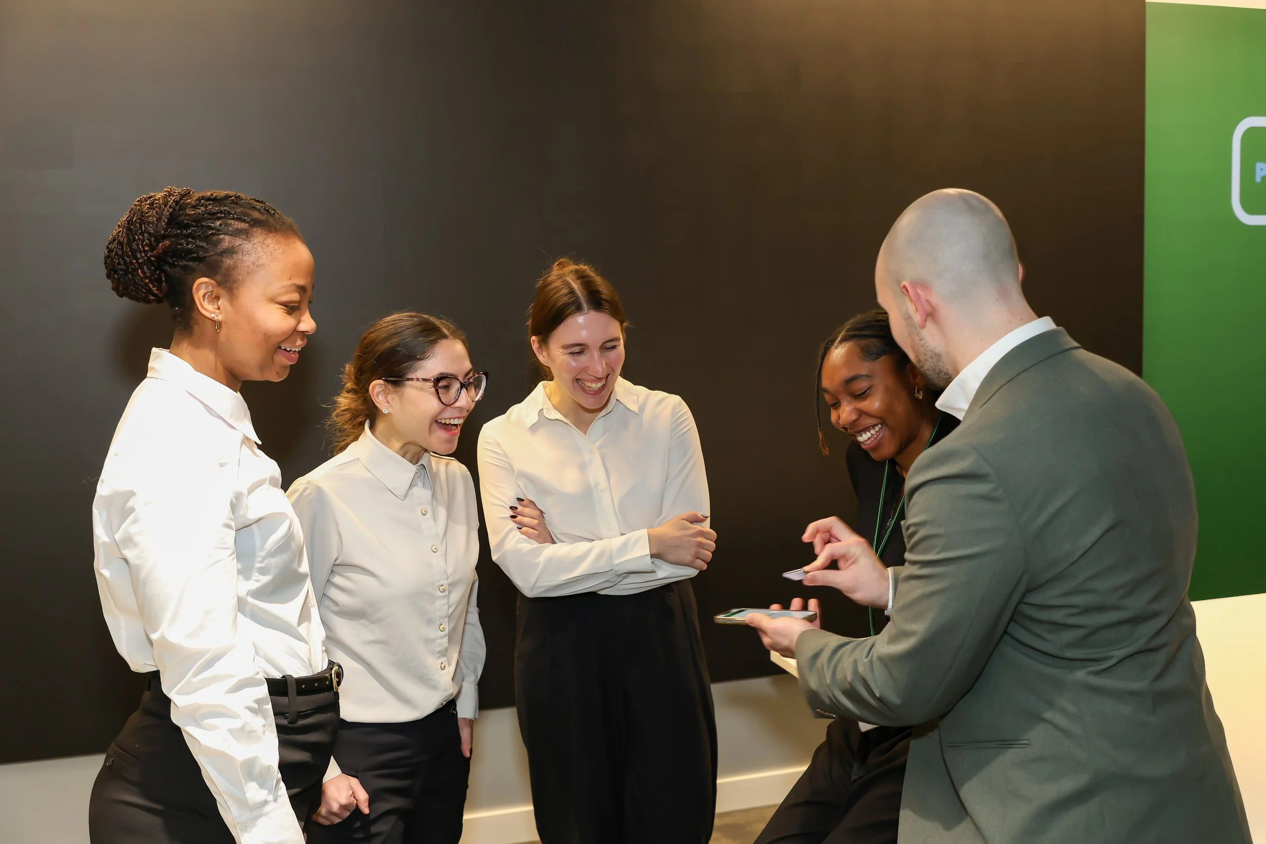 Interactive cellphone trick delights guests during a corporate reception.