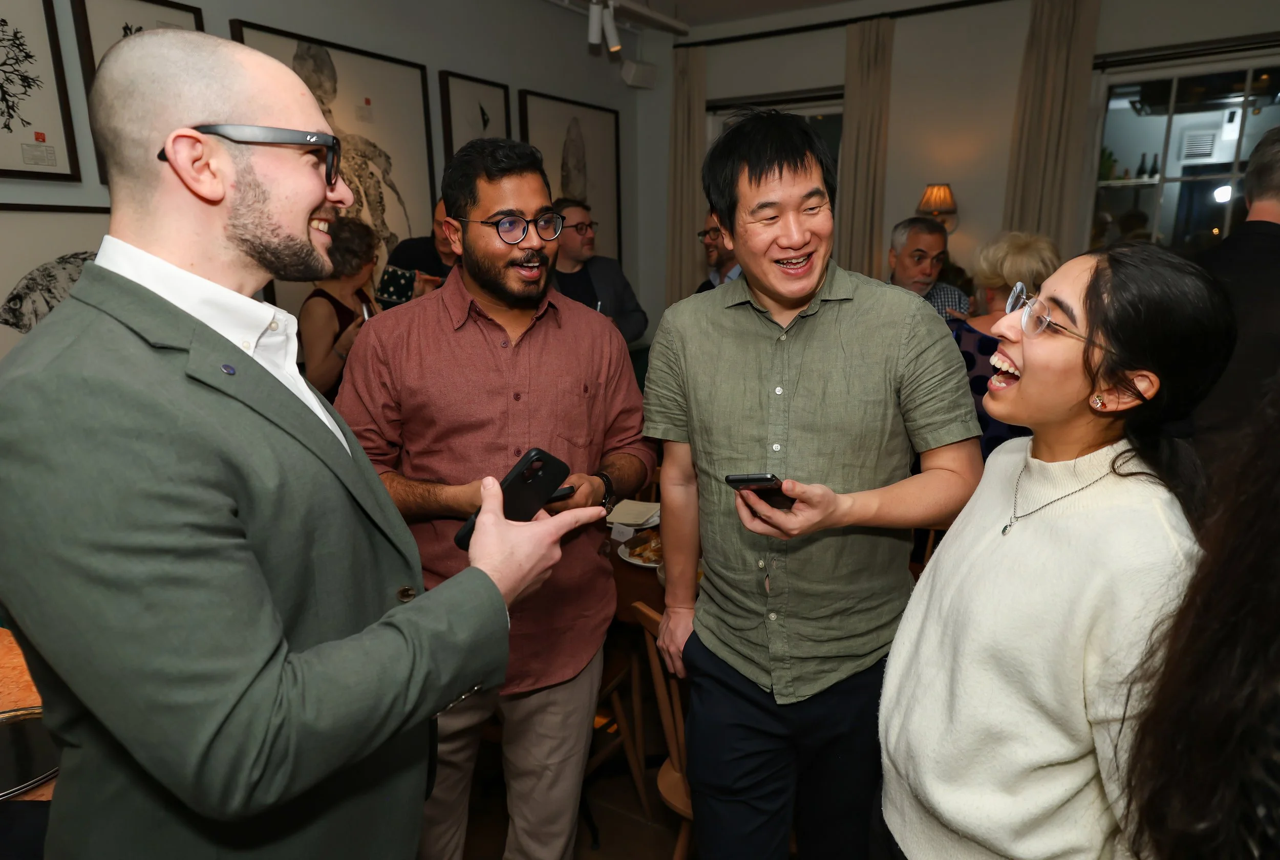 Guests experiencing laughter and surprise through interactive close-up magic.