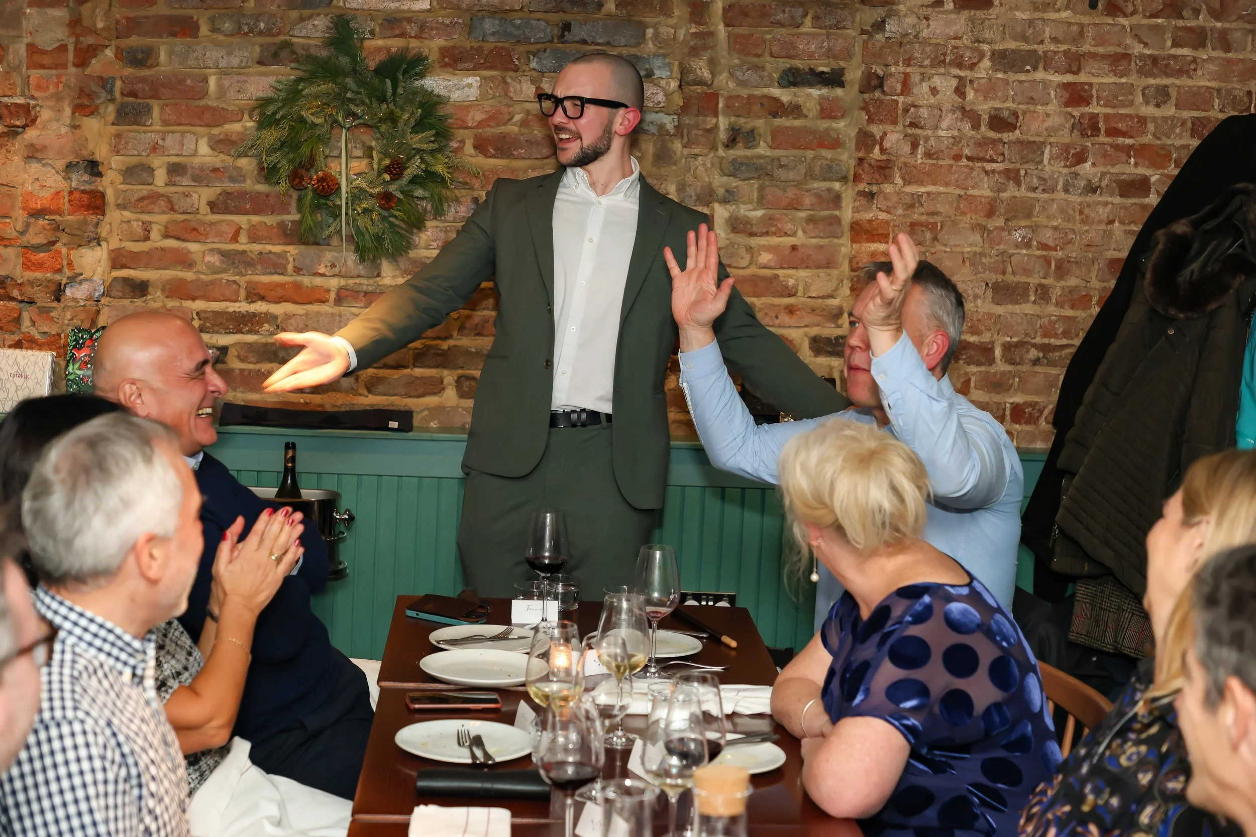 agician finishing a successful corporate party as guests enjoy the final moments.