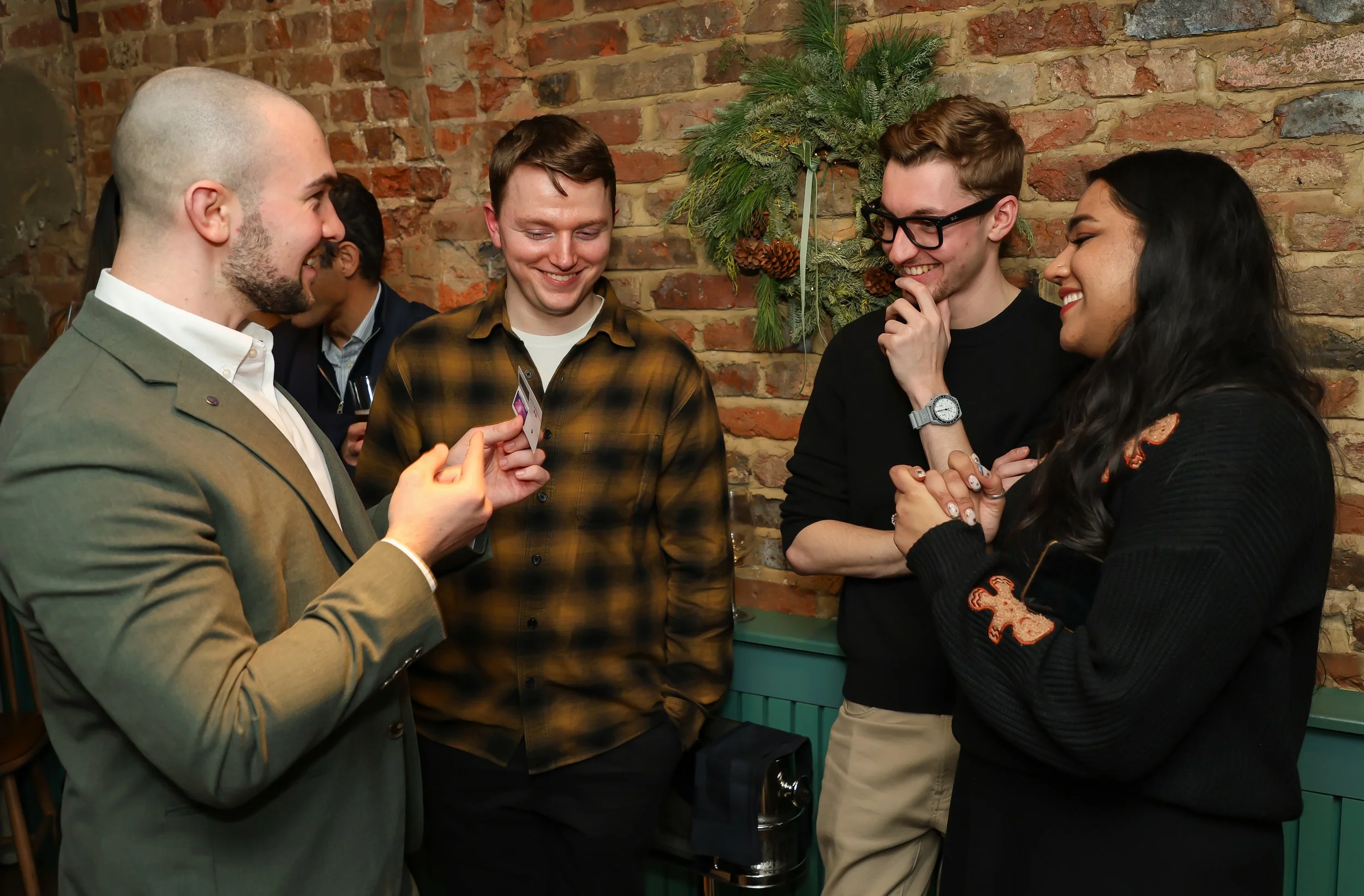 Live interactive illusion performance entertaining guests during the event reception.