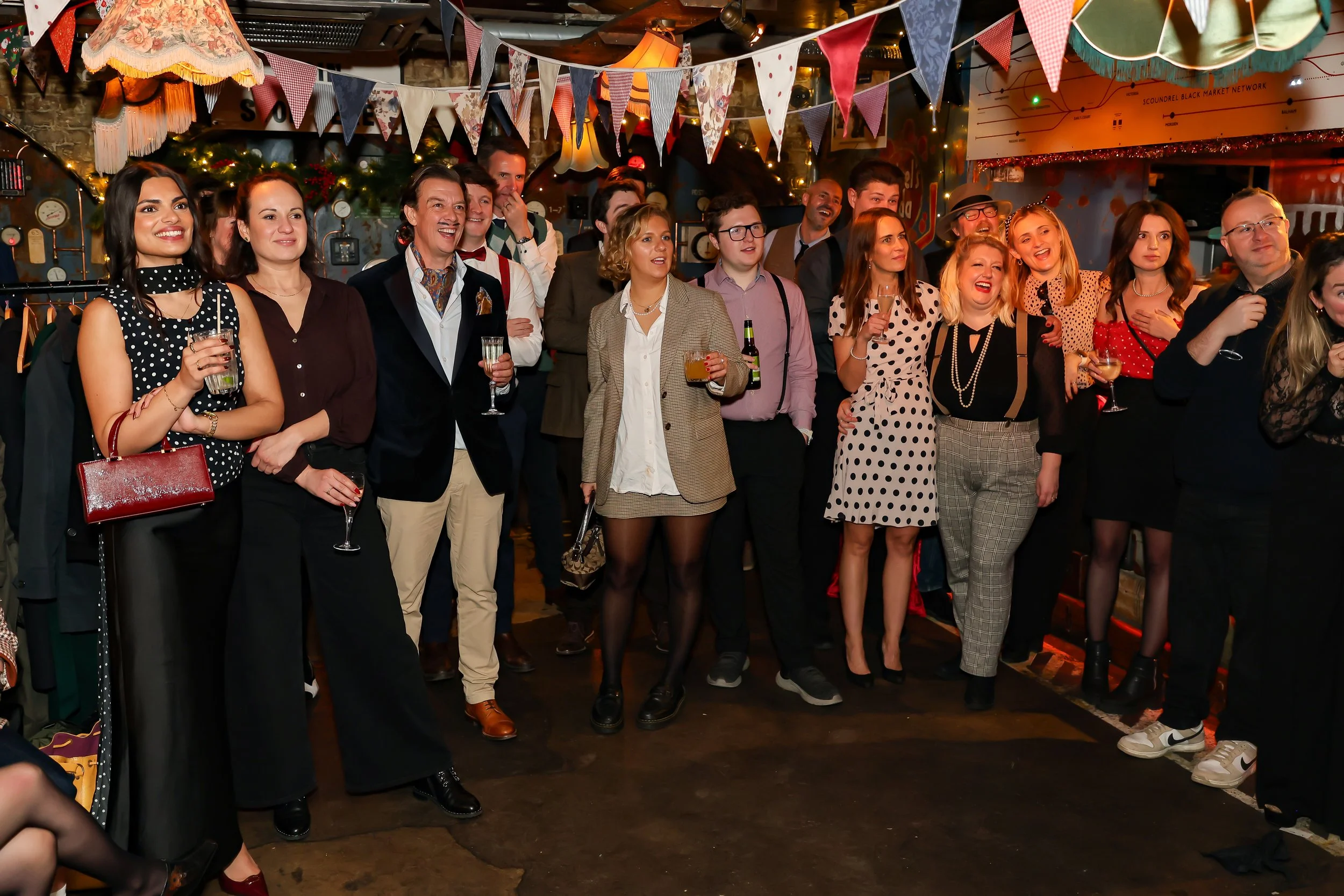 Magician performing walk-around magic for guests at reception.