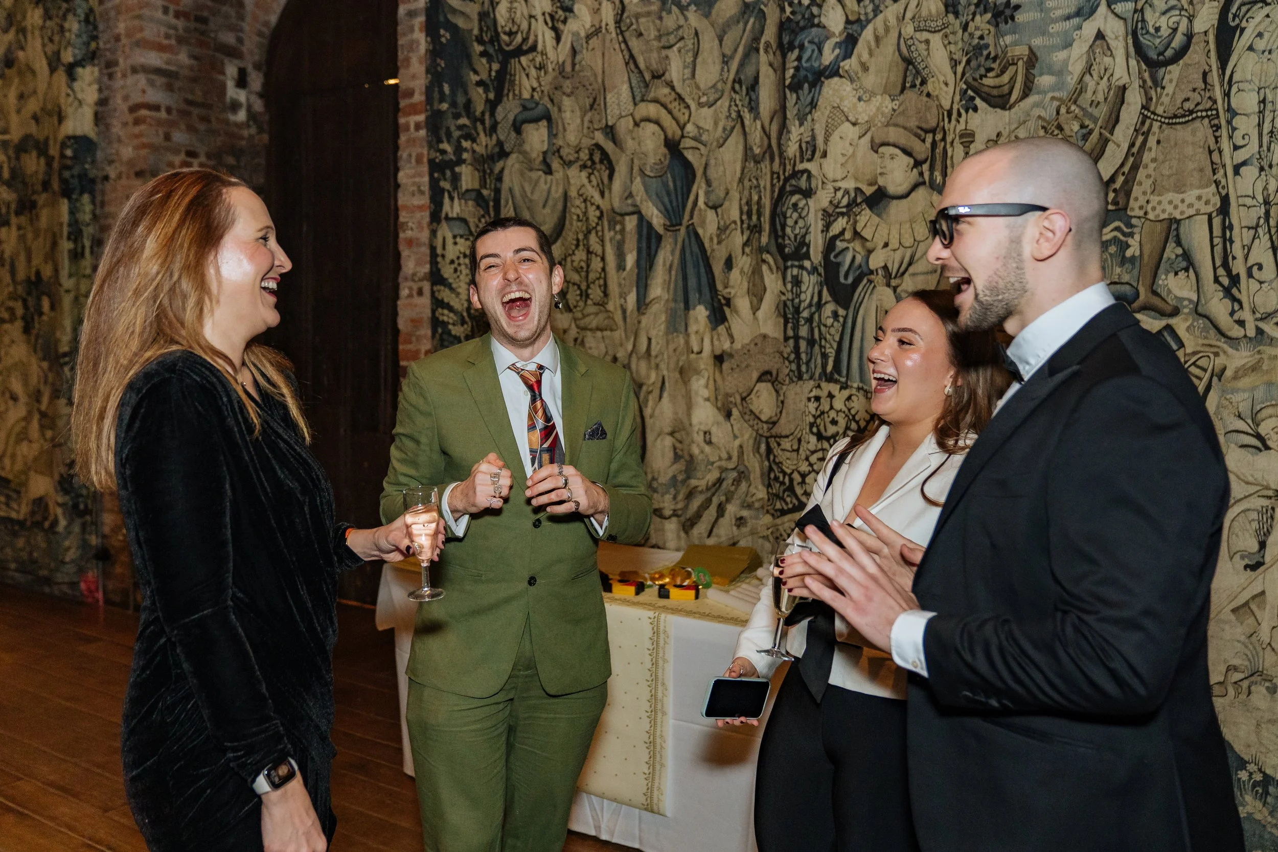 Magician entertaining corporate guests with hands-on illusions, creating laughter and amazement during the dinner event.