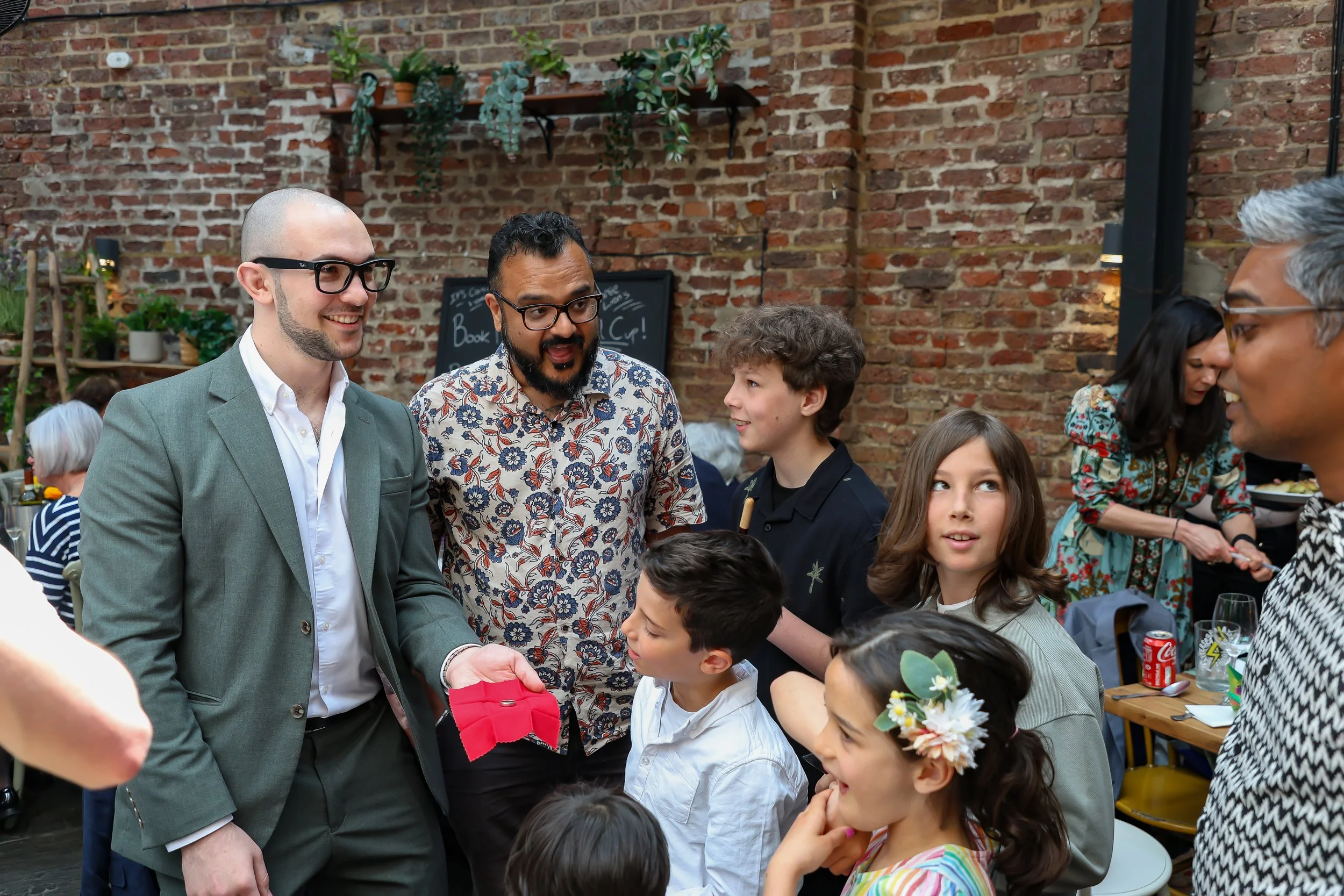Kids love the moment with the Magician. 2026-May 3 Rhoda & Baruch Golden Wedding Anniversary. 
