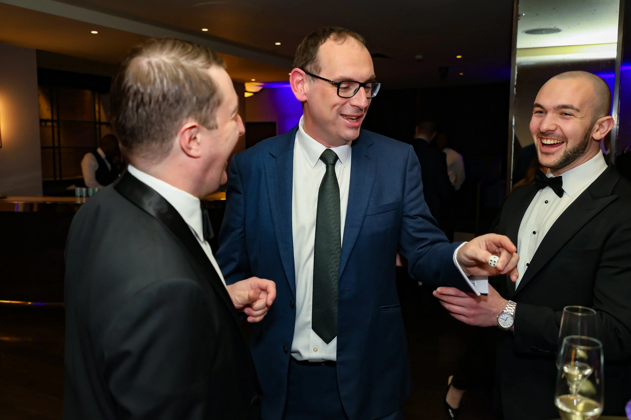 Corporate guests enjoying interactive magic  at a corporate event.