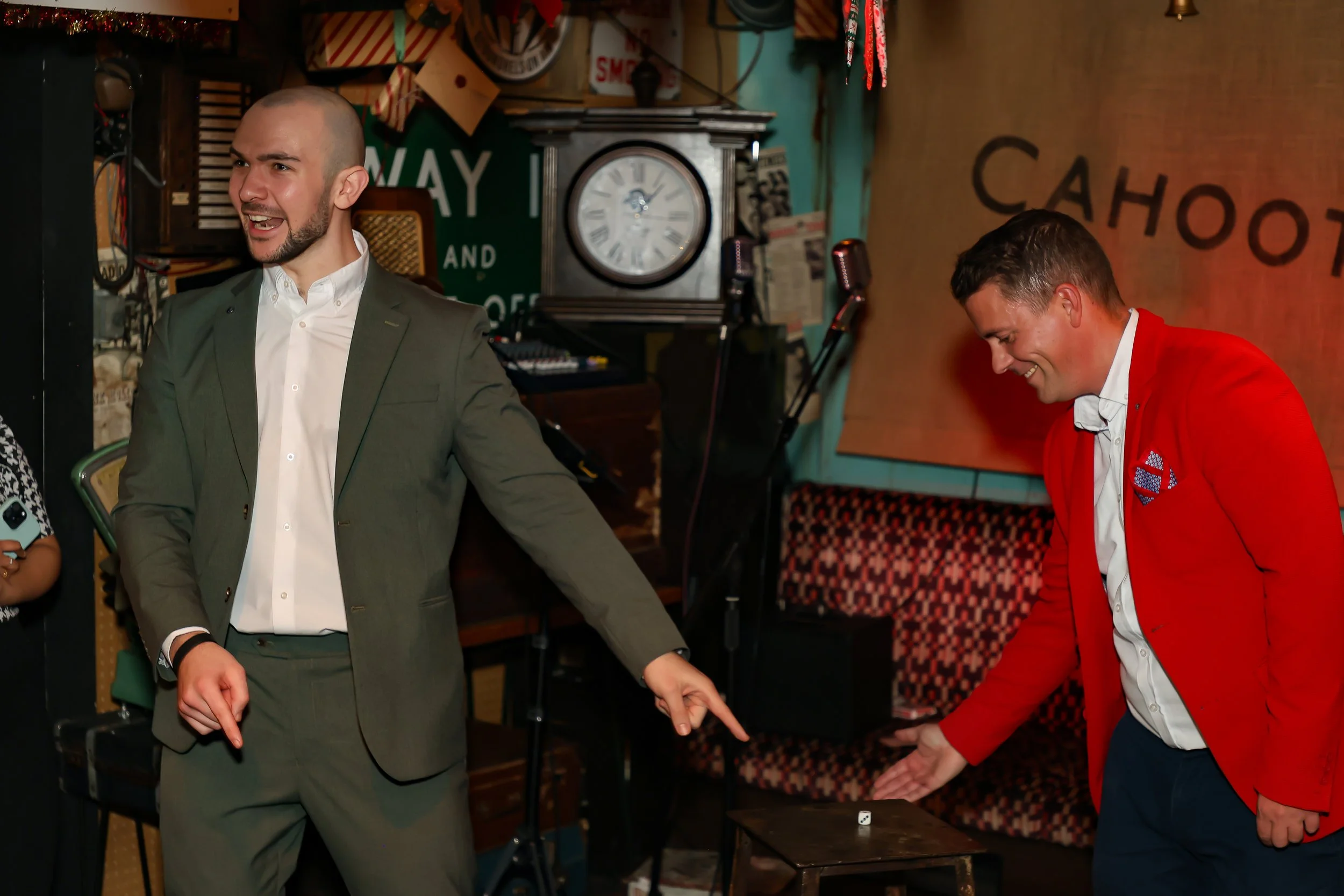 Guest actively involved in an interactive magic show during the event.