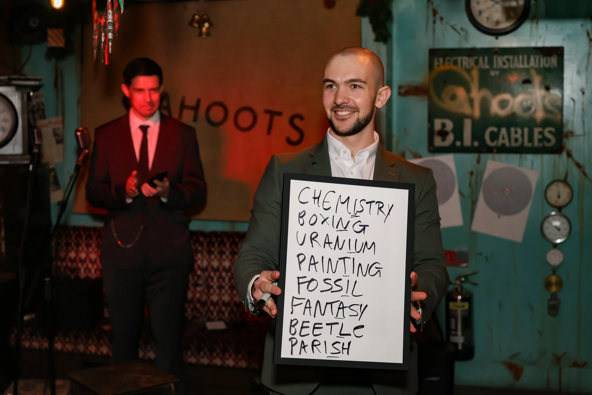 Professional magician displaying the outcome of audience involvement at a corporate reception.