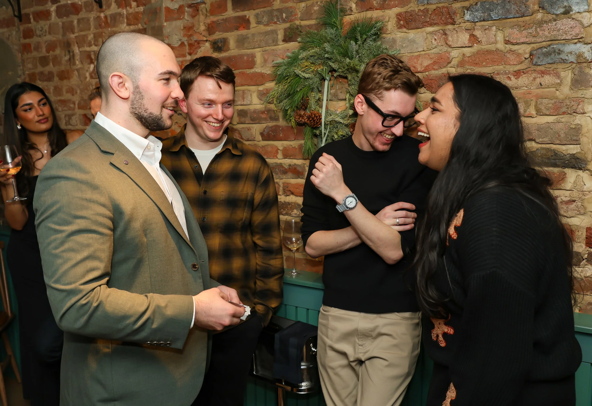 Intimate interactive magic entertaining guests with light-hearted moments and reactions.