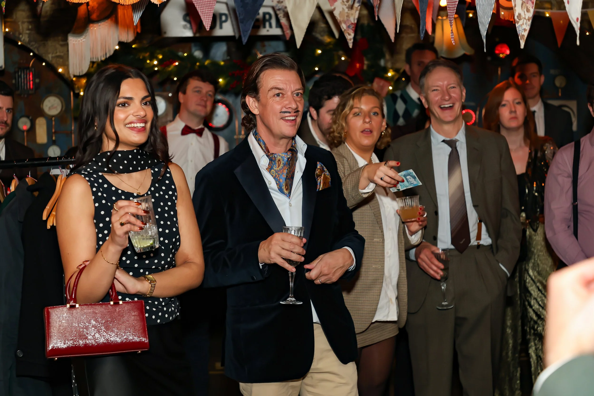 Guests gathered to watch a live magic performance during the corporate reception.