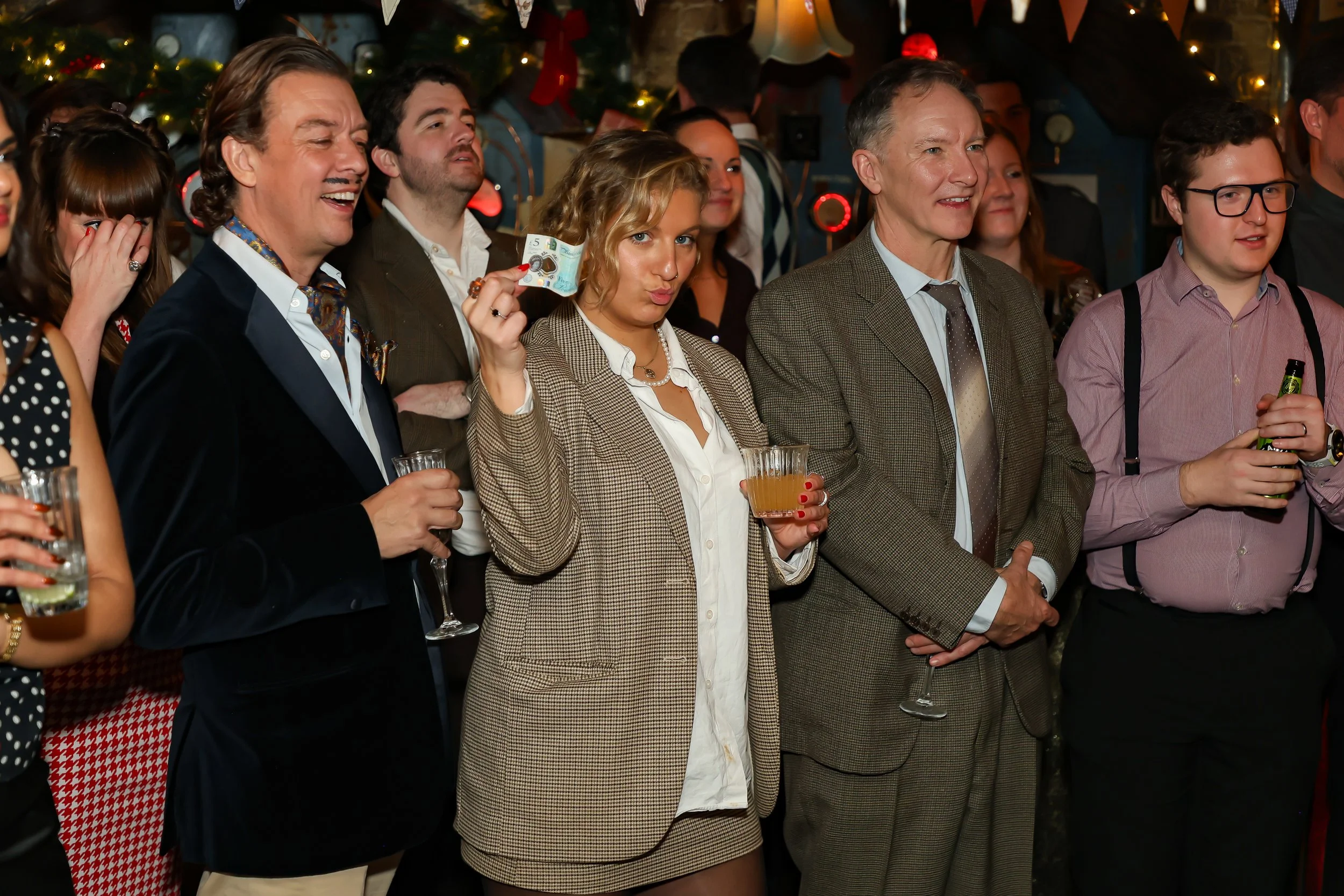 Audience watching closely as the magician displays skilled hand magic.