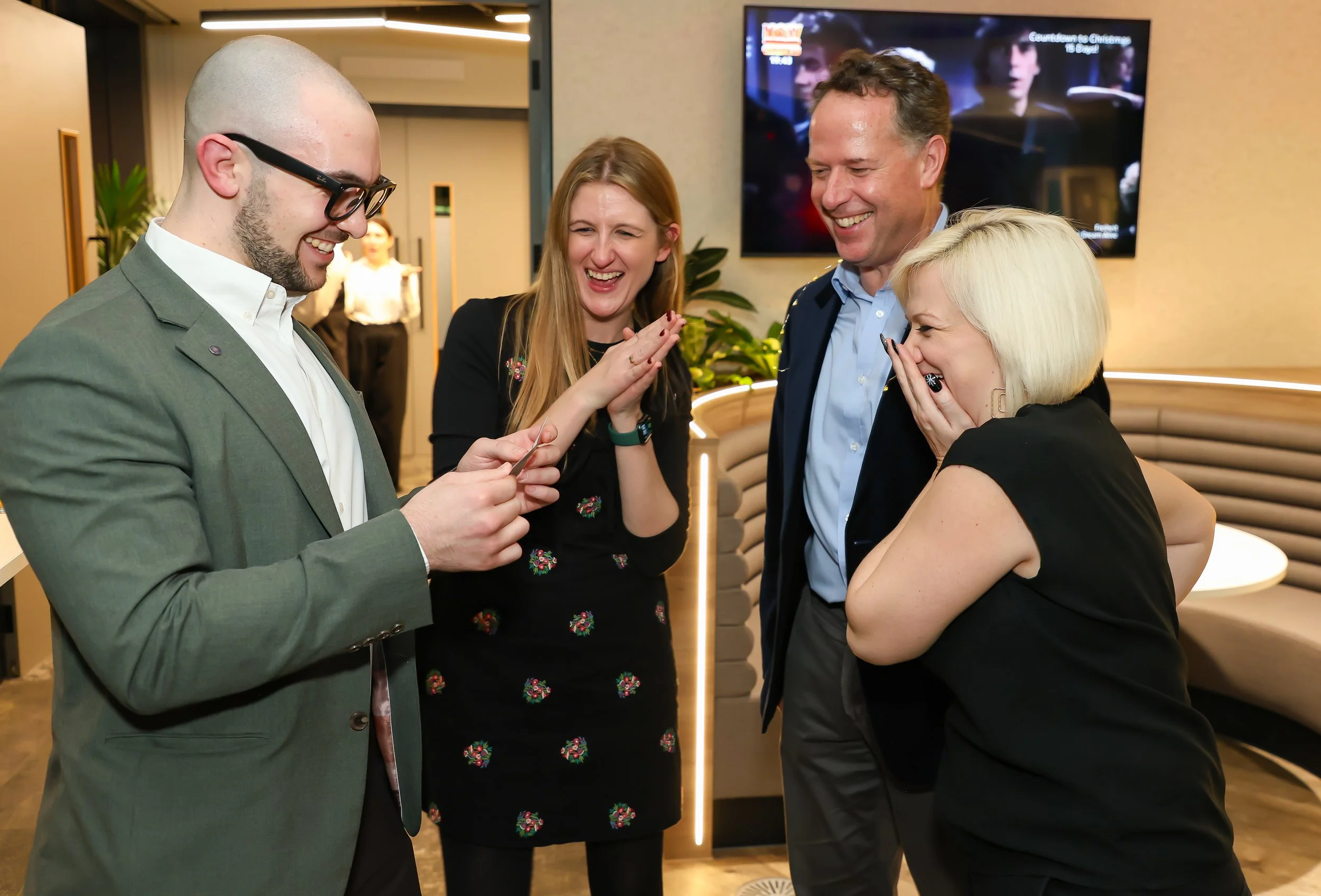 Close-up card magic leaves corporate guests amazed.