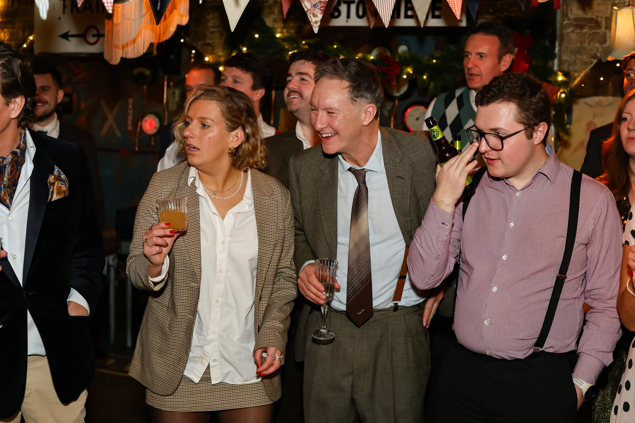 Magician performing walk-around magic for guests at reception.