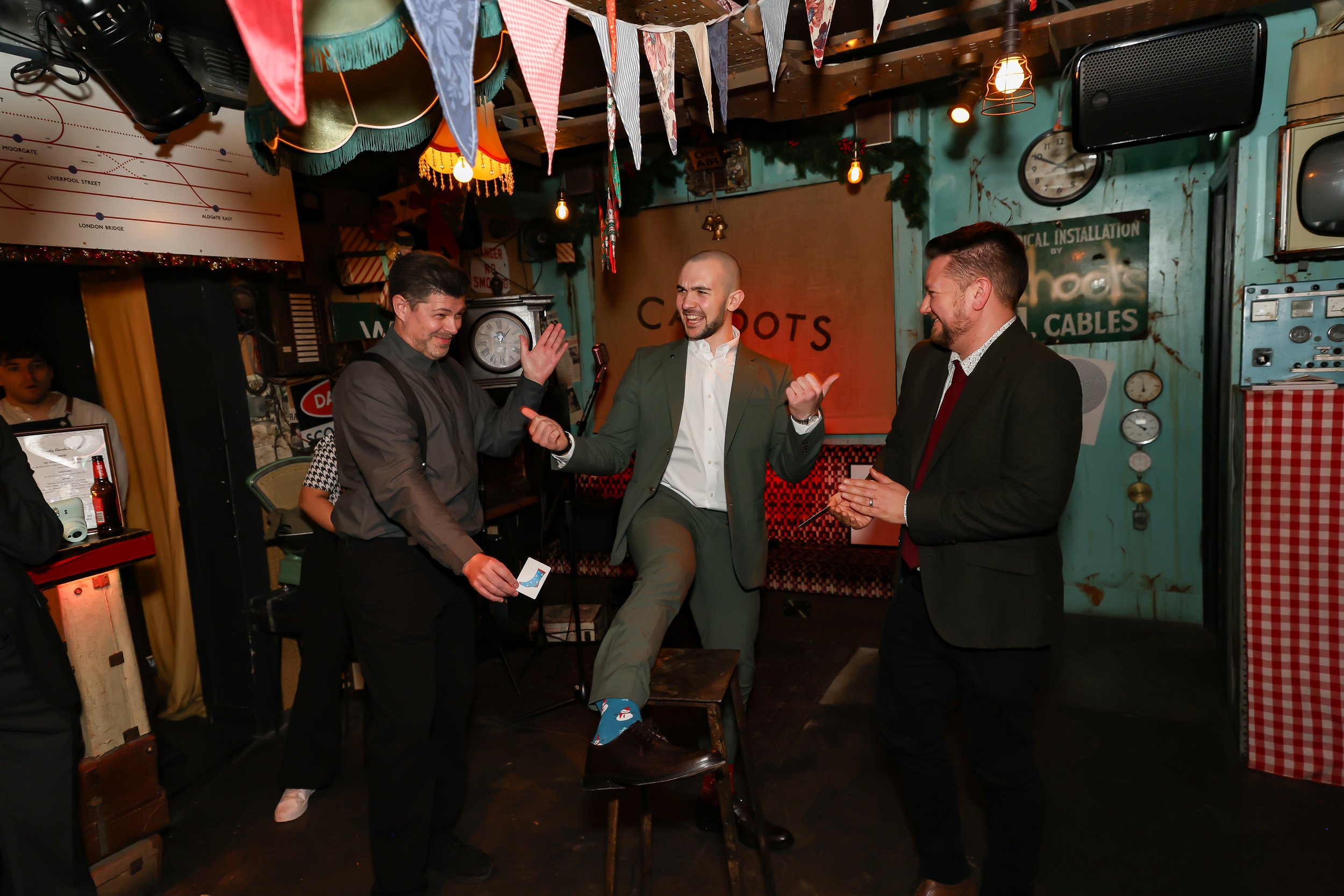 Magician performing walk-around magic for guests at reception.
