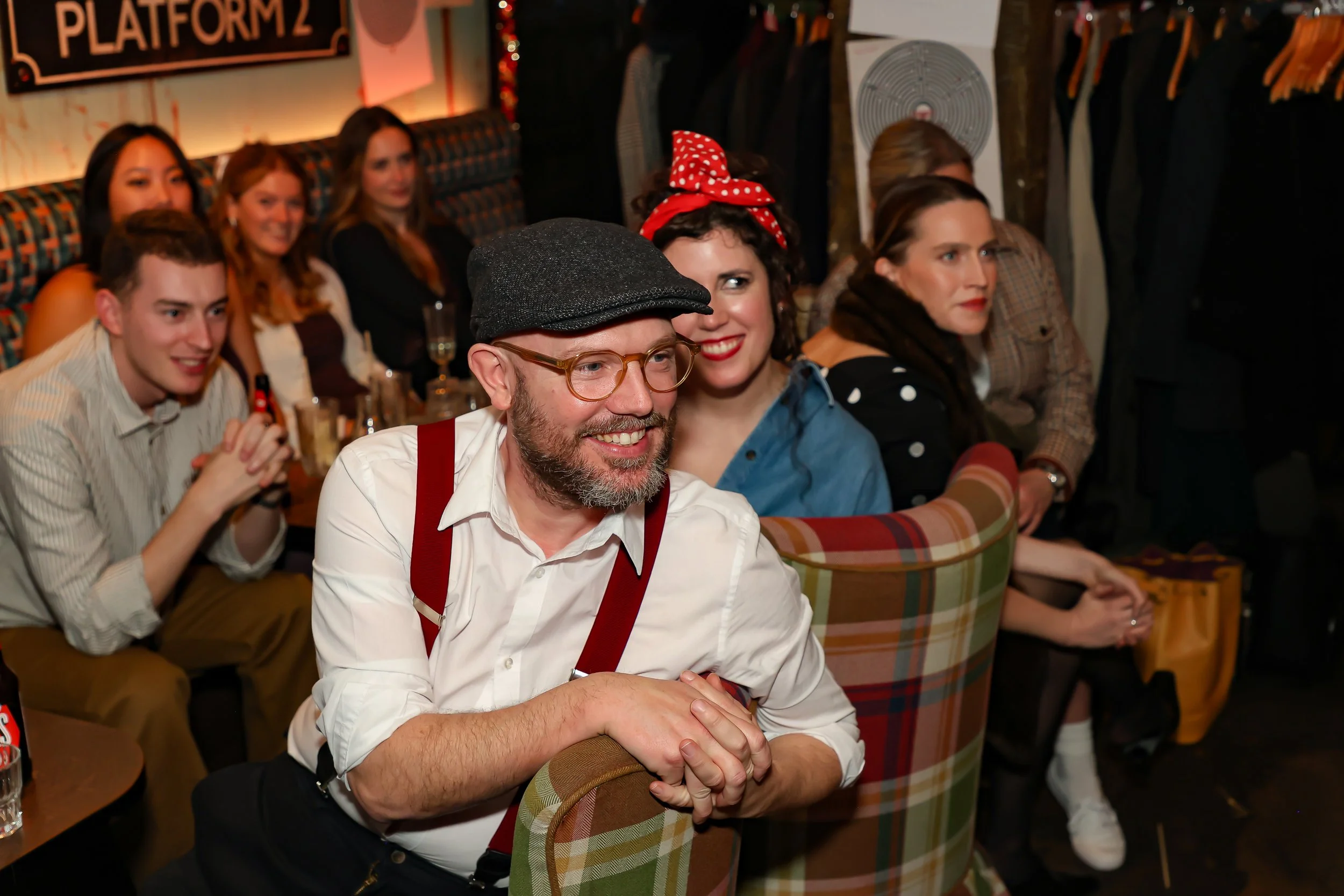 Magician performing walk-around magic for guests at reception.