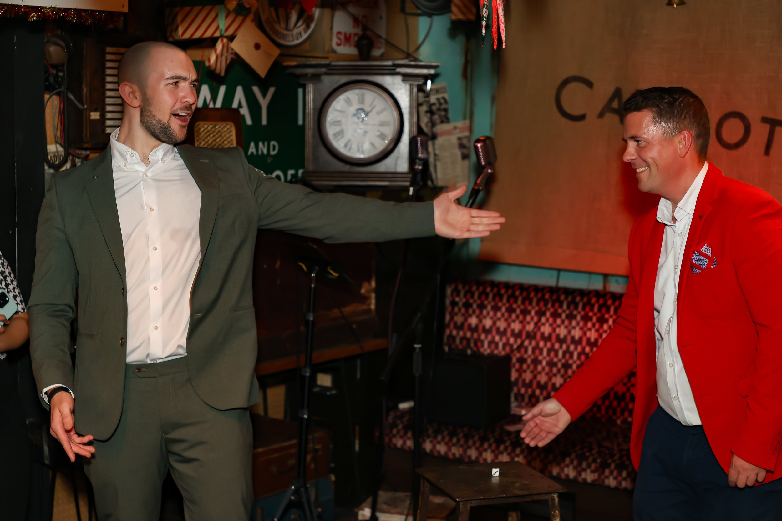 Guest actively involved in an interactive magic show during the event.