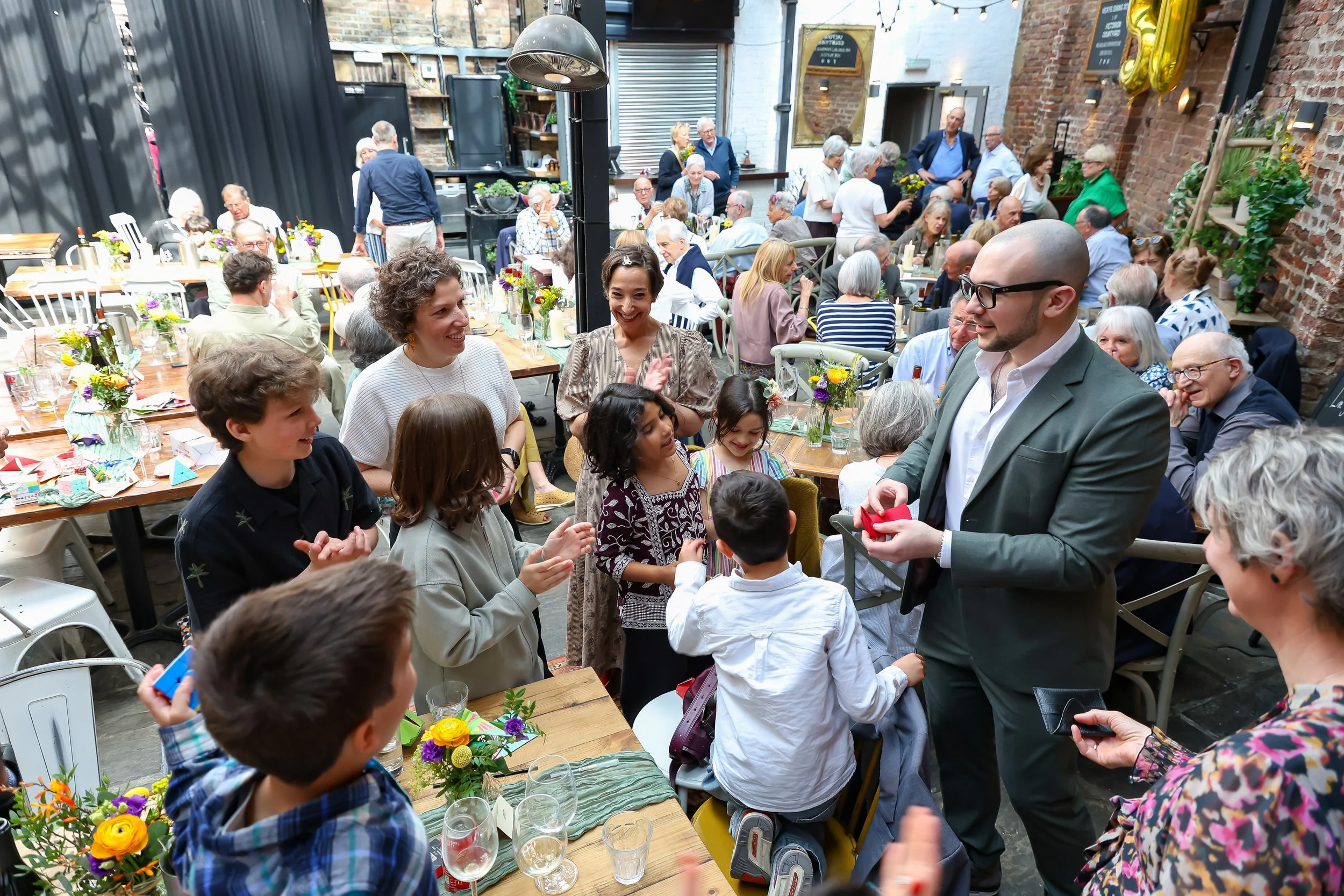 Magical moment with the amazing magician and kids. 2026-May 3 Rhoda & Baruch Golden Wedding Anniversary. 