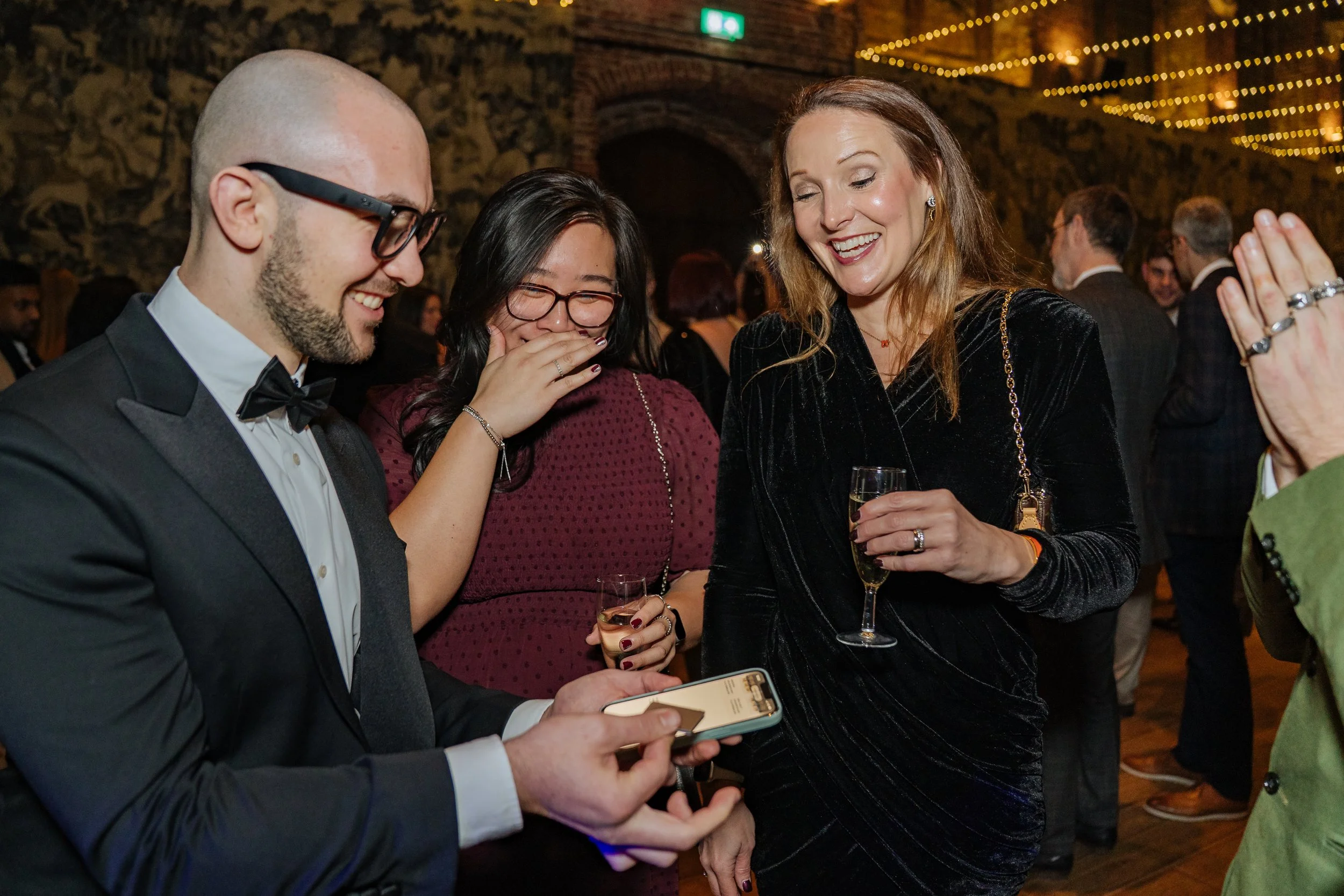 Close-up magic performance by a magician for a small group of corporate attendees, enhancing the gala dinner experience.