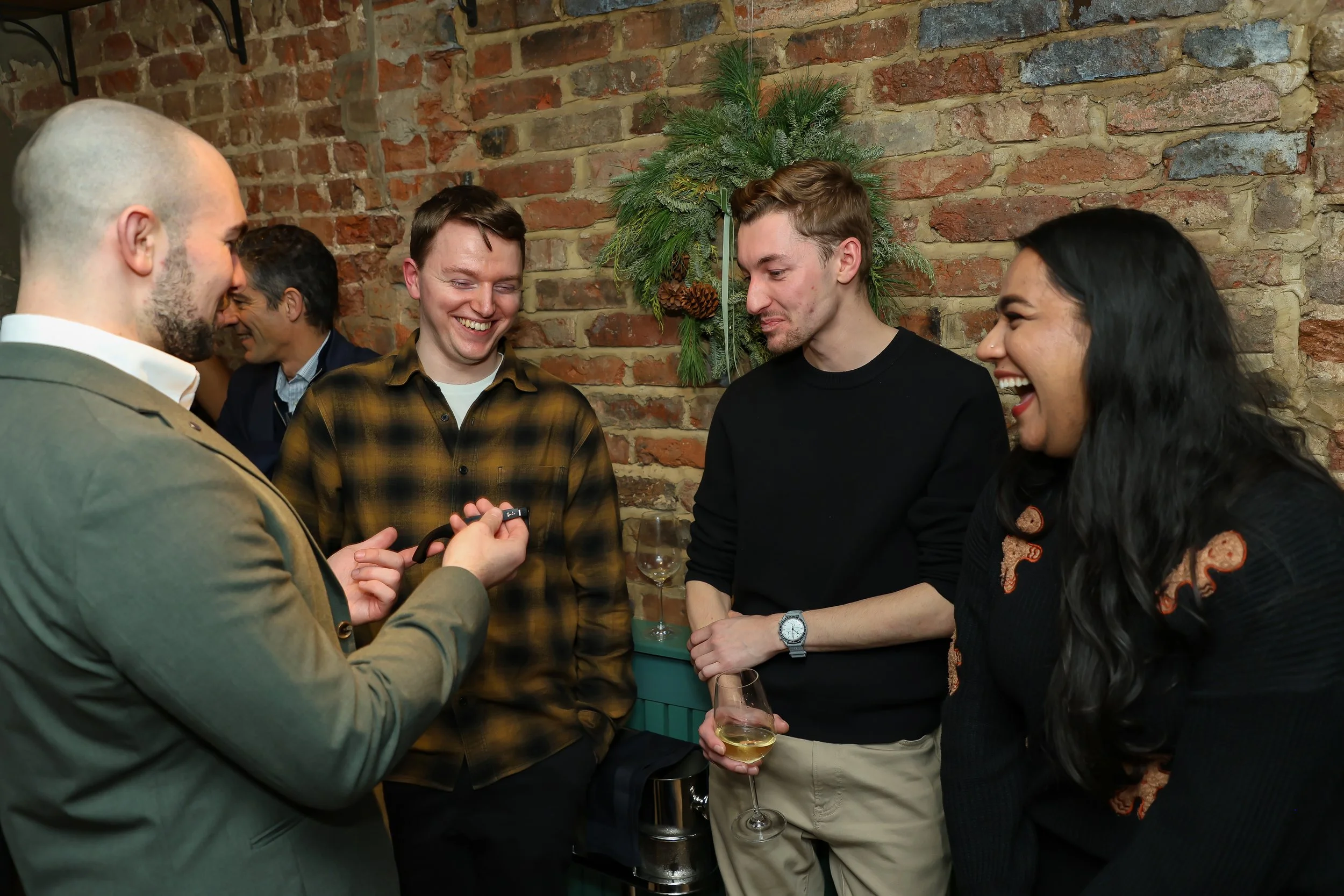Guests experiencing laughter and surprise through interactive close-up magic.