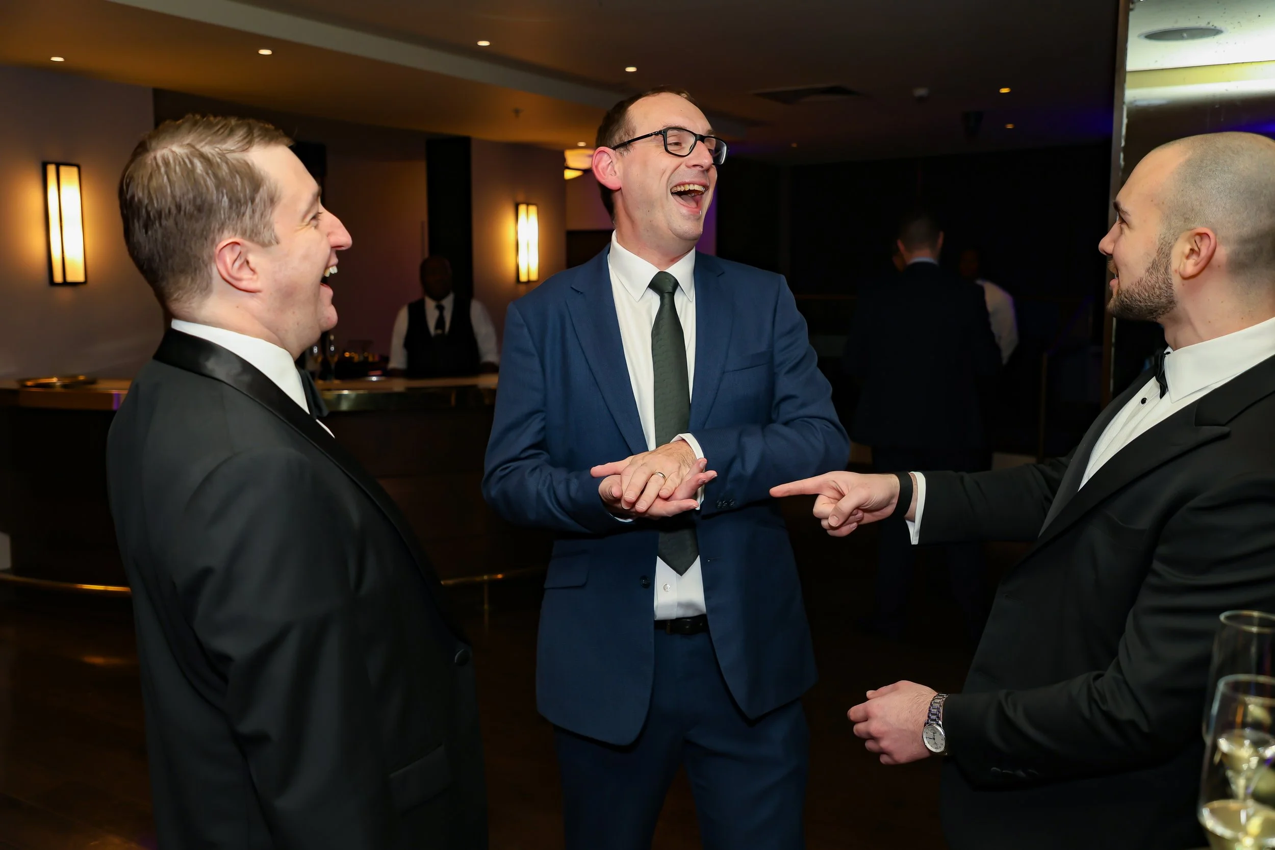 Corporate guests enjoying interactive magic  at a corporate event.