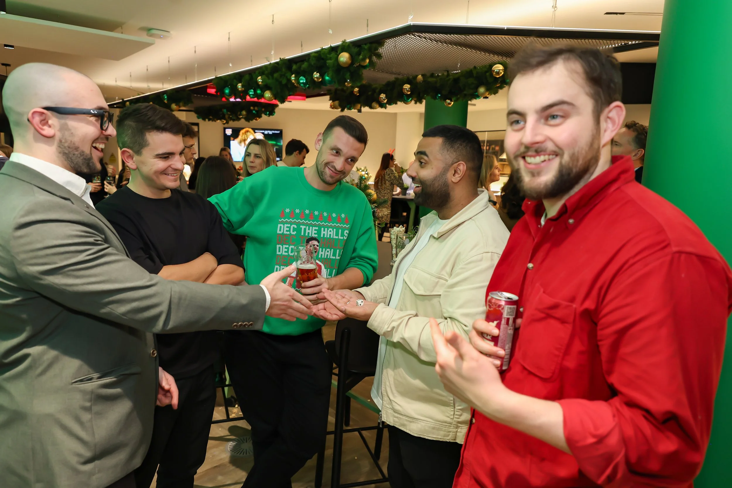 Guests delighted by an interactive magic trick performed by the magician at the corporate reception.