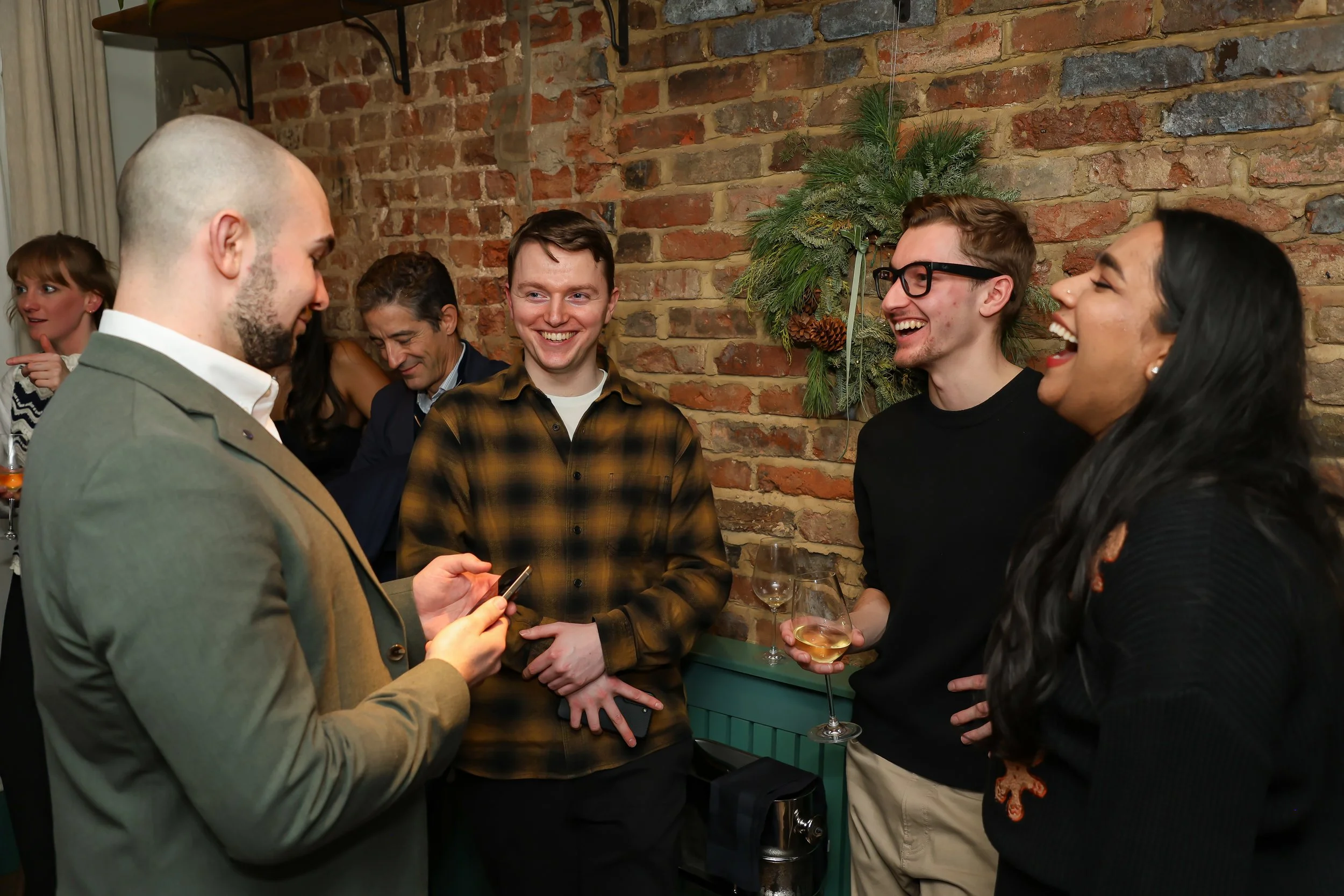 Small-group interactive magic creating moments of laughter and surprise for guests.