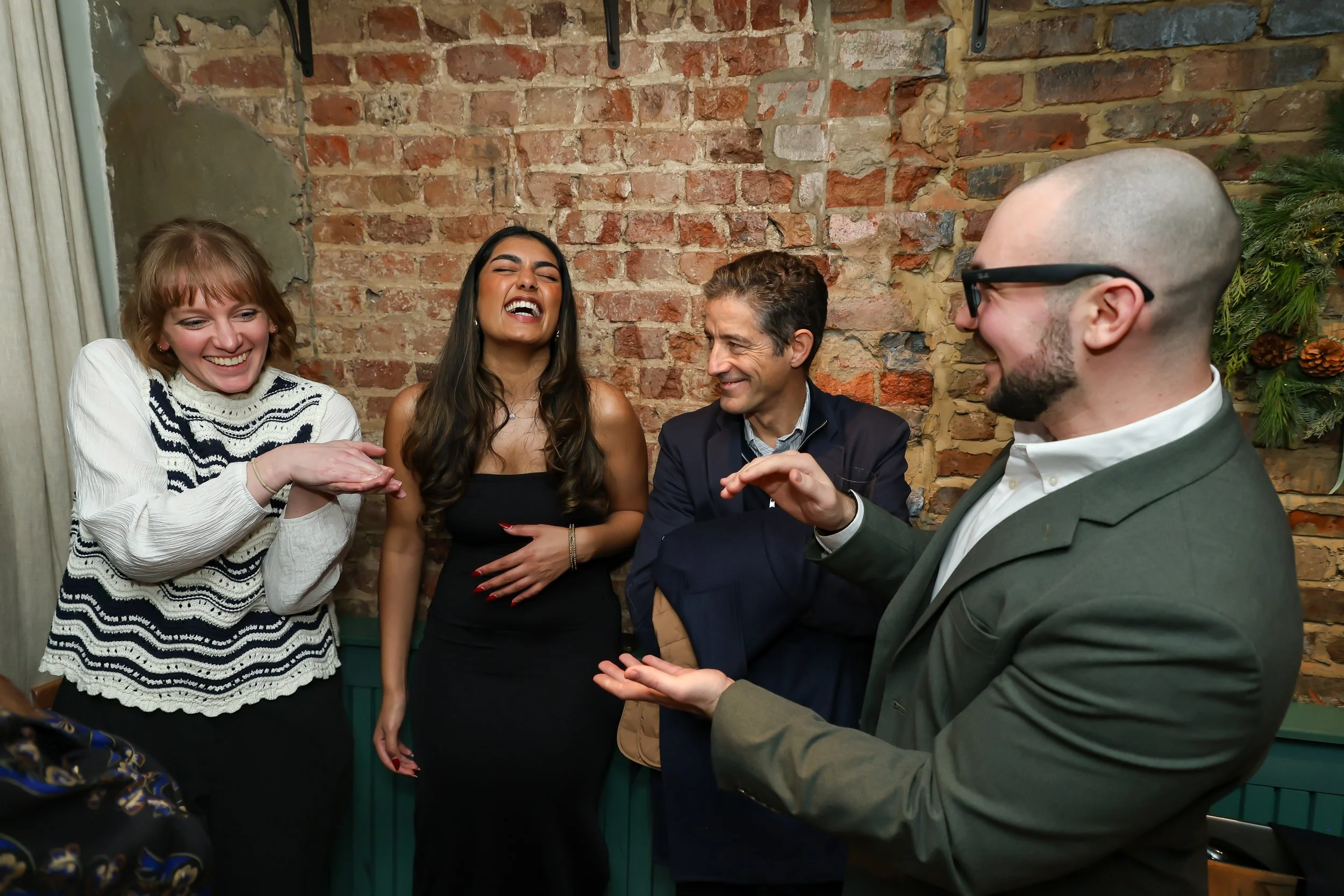 Magician finishing a successful corporate party as guests enjoy the final moments.
