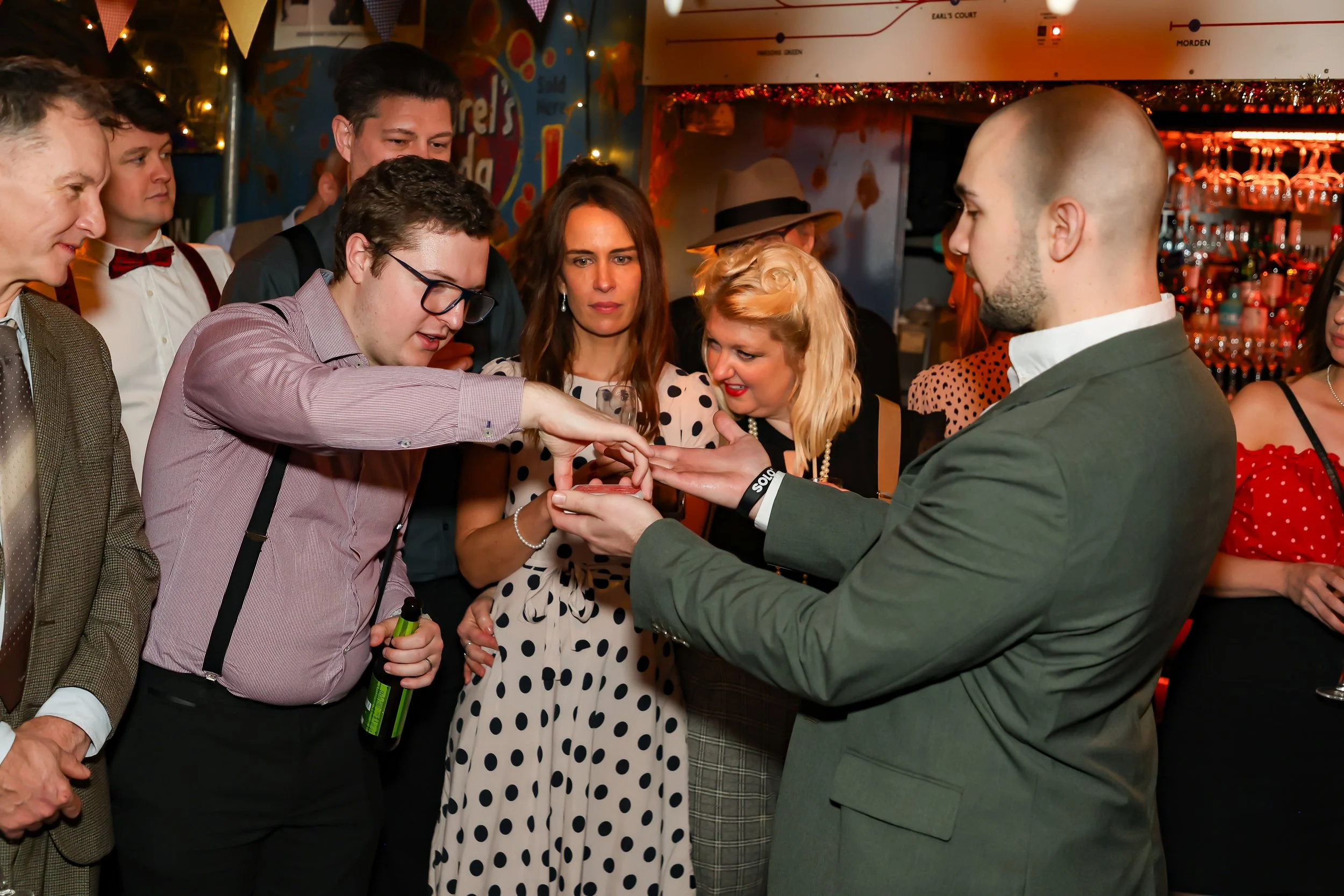 Corporate guests participating and enjoying moments of live entertainment.