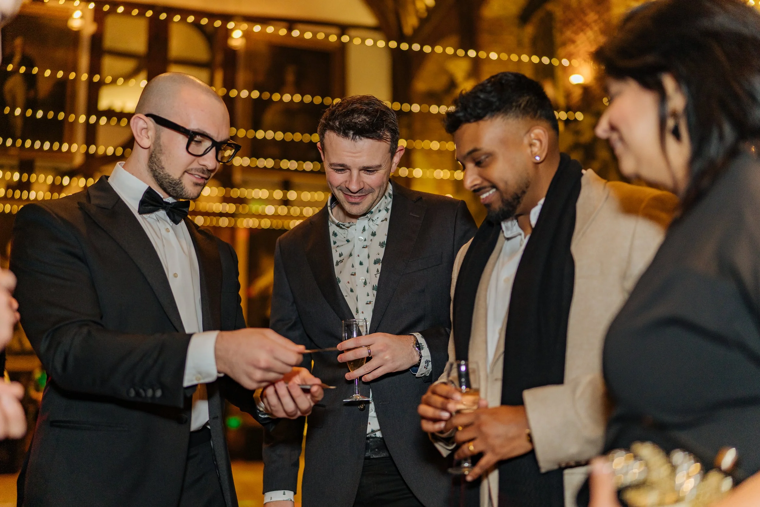 Corporate guests enjoying close-up magic during a formal corporate event.