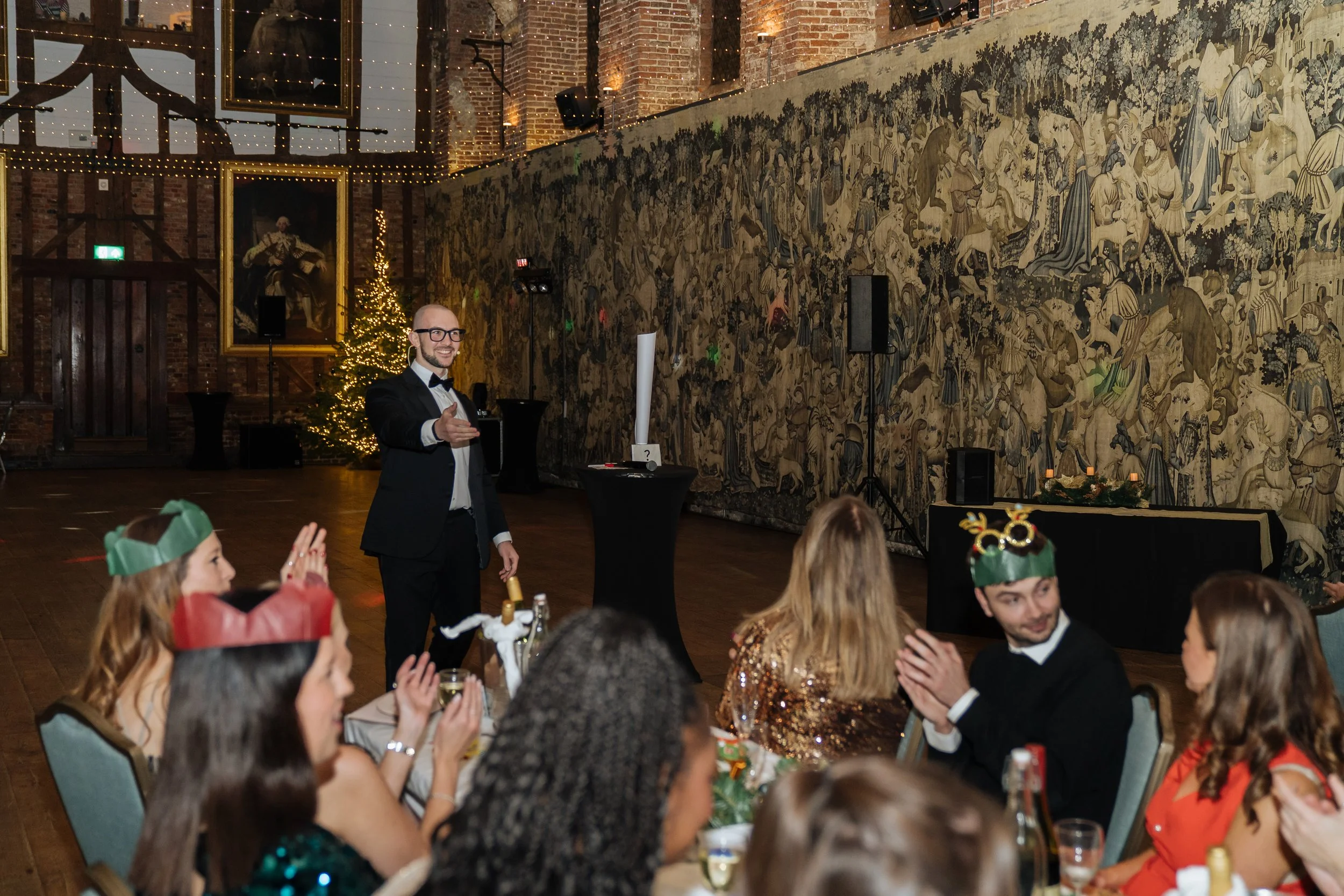 Live magic entertainment delivered to business professionals at a company dinner.