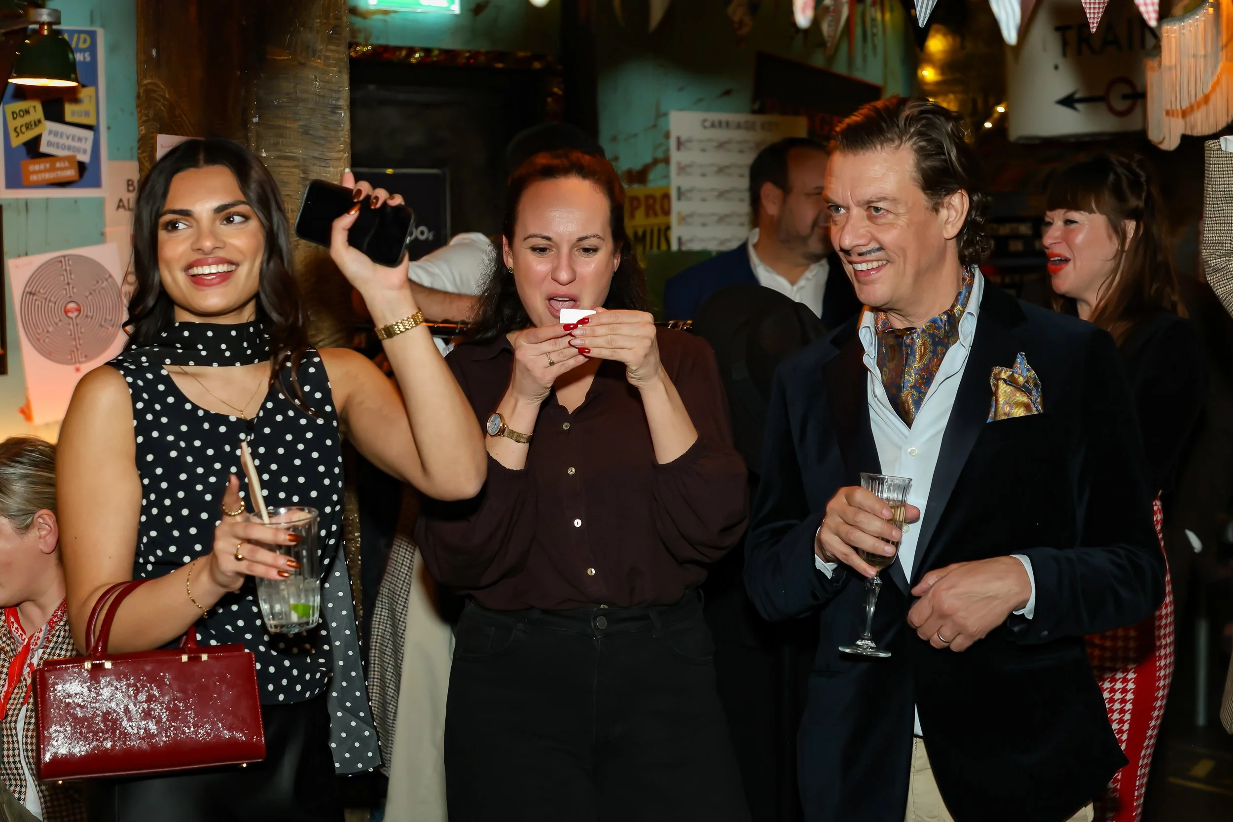 London Magician performing walk-around magic for guests at reception.