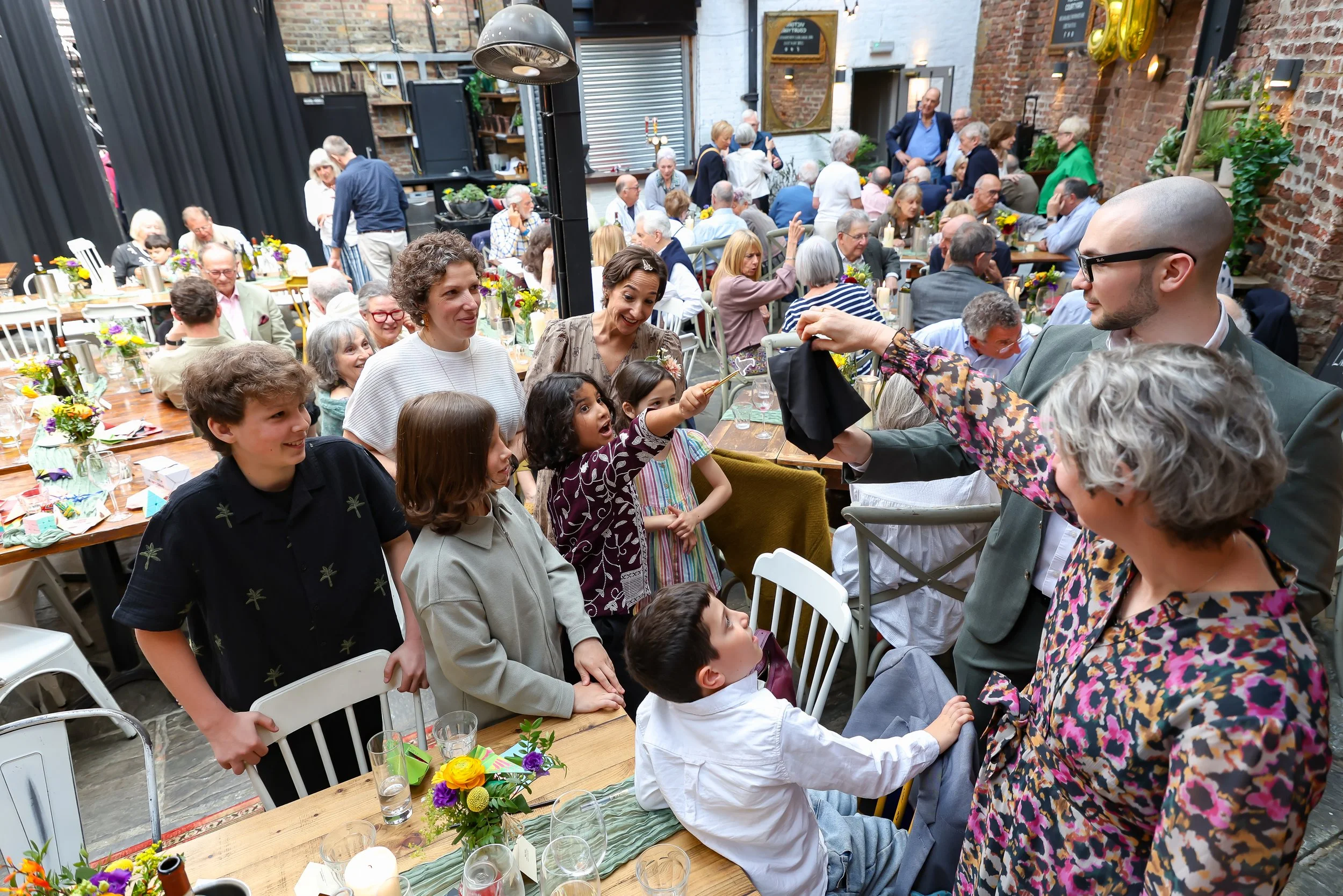 Magical moment with the amazing magician and kids. 2026-May 3 Rhoda & Baruch Golden Wedding Anniversary. 
