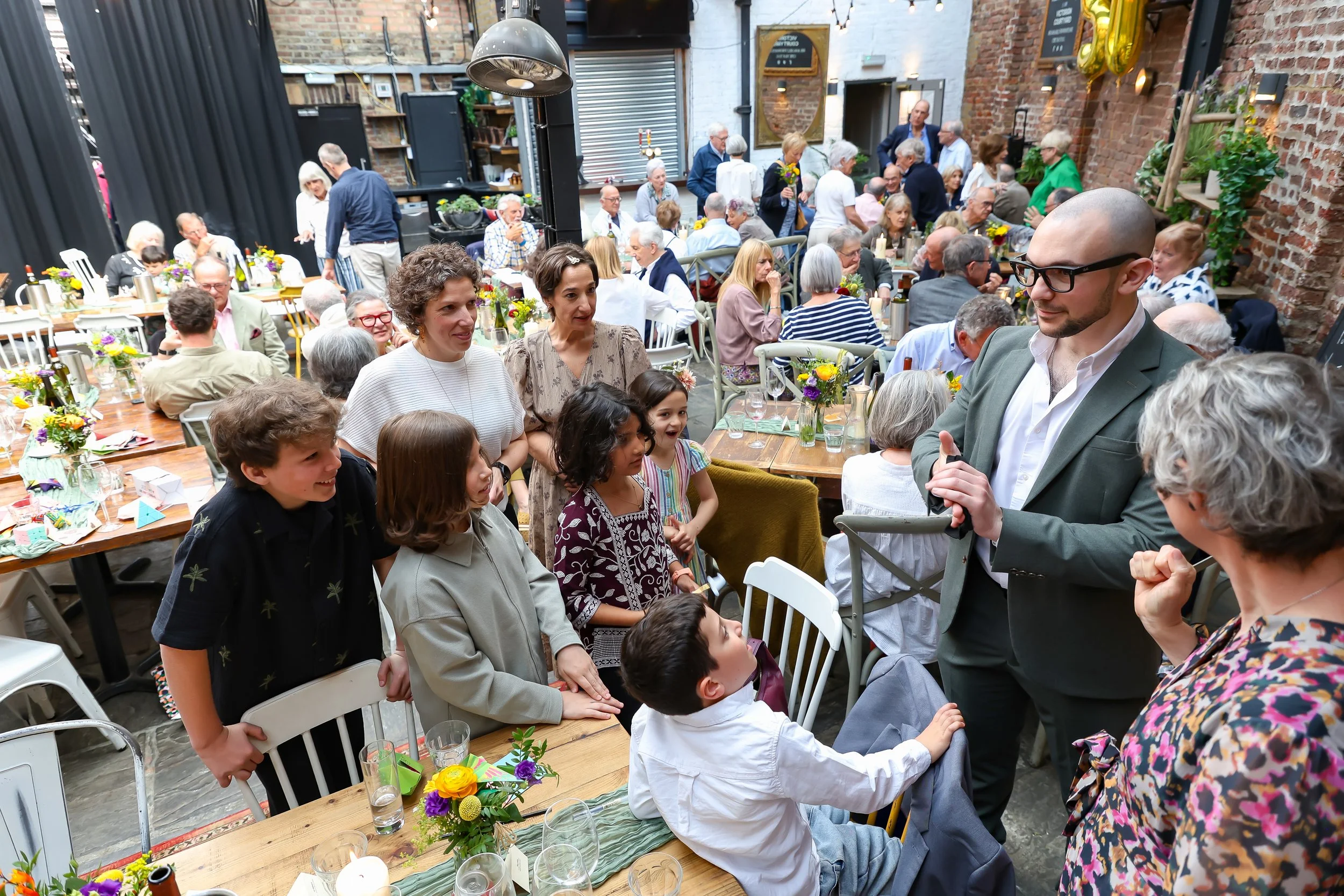 Magical moment with the amazing magician and kids. 2026-May 3 Rhoda & Baruch Golden Wedding Anniversary. 
