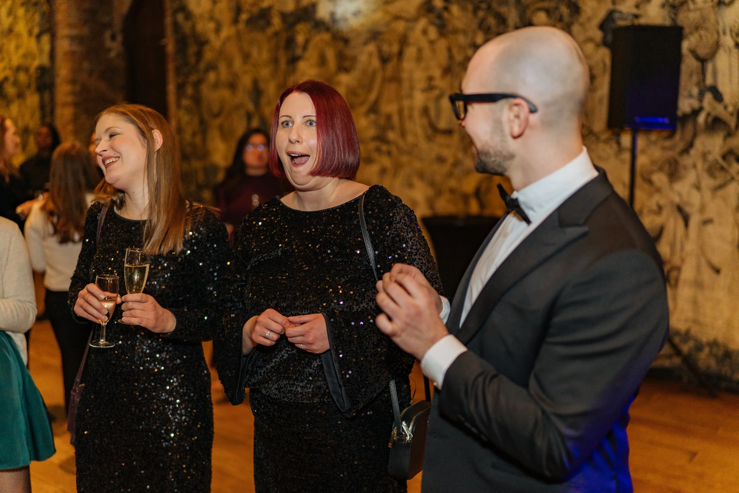 Professional magician entertaining executives at a London corporate gathering.
