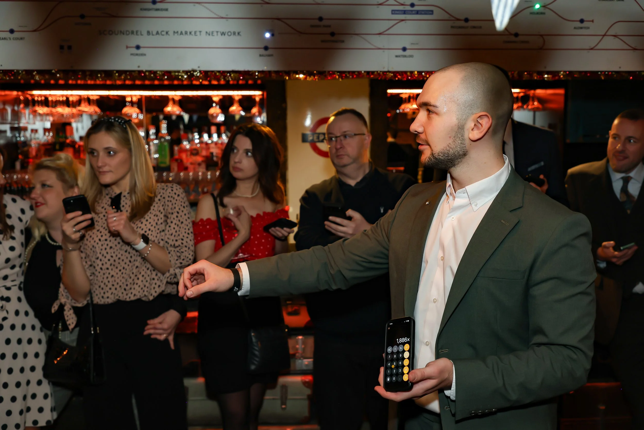 Magician showing his hands to the audience during a close-up hand magic performance.