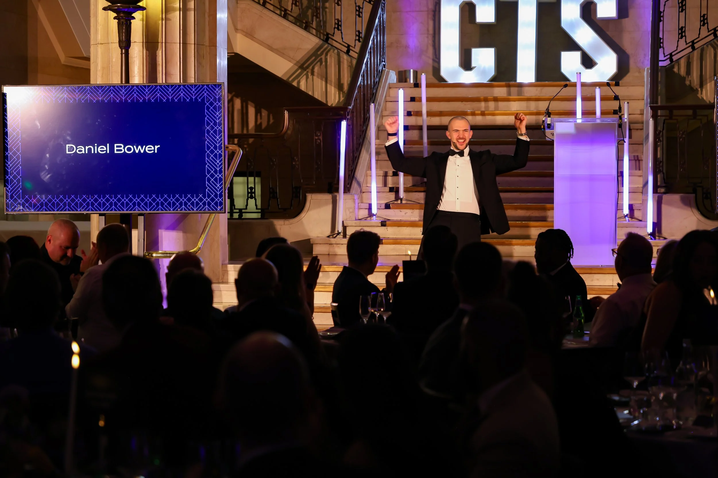 A skilled event host & magician balancing structure and spontaneity to keep the room energised and focused.