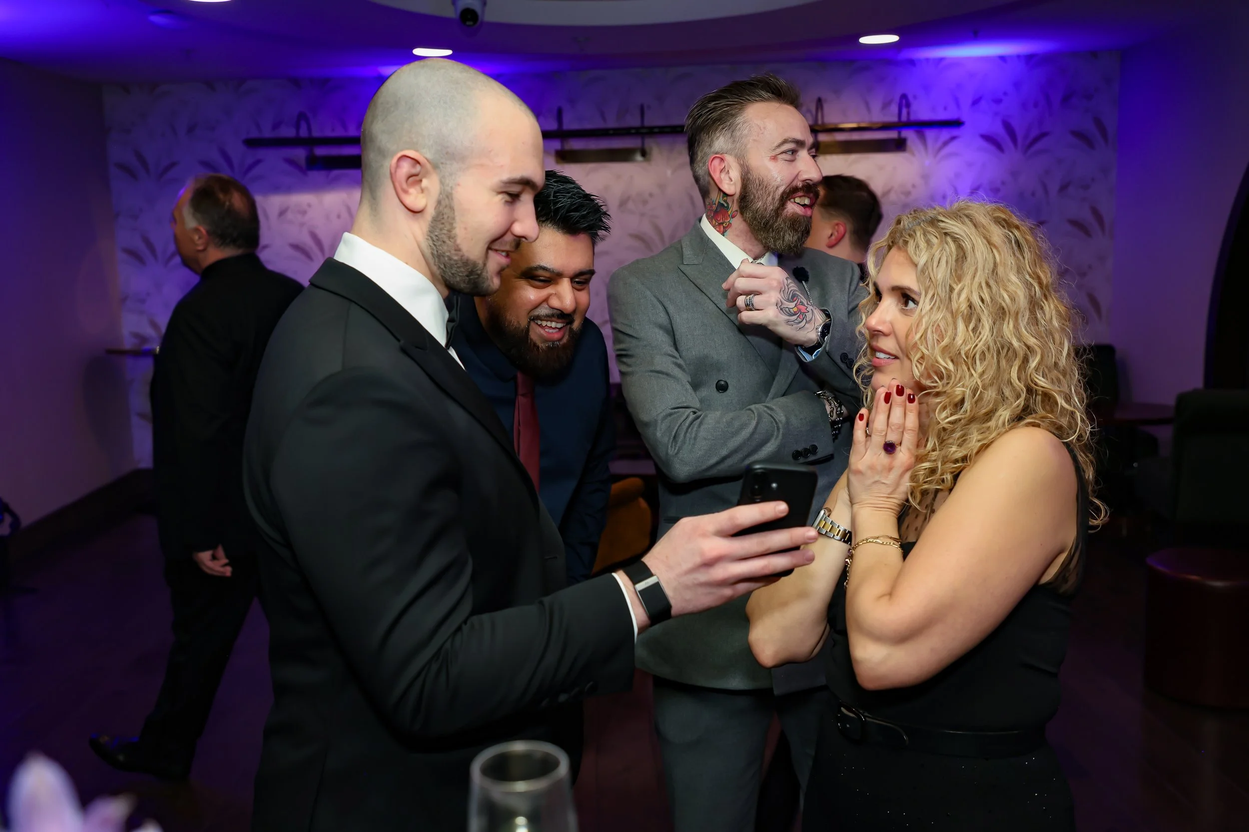 Magician captivating corporate employees with a close-up trick routine.