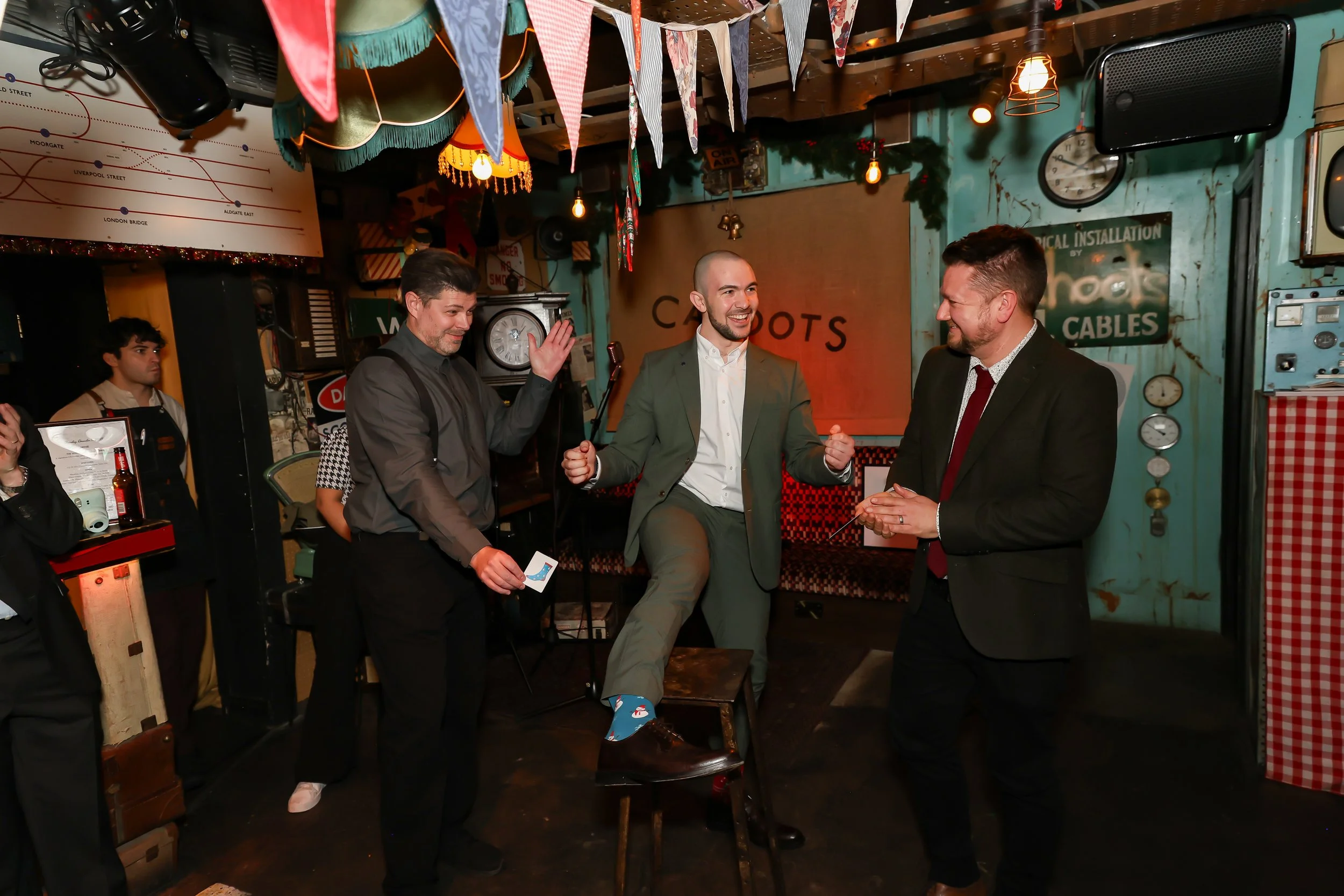 Guests enjoying hands-on interaction during a live magic show.