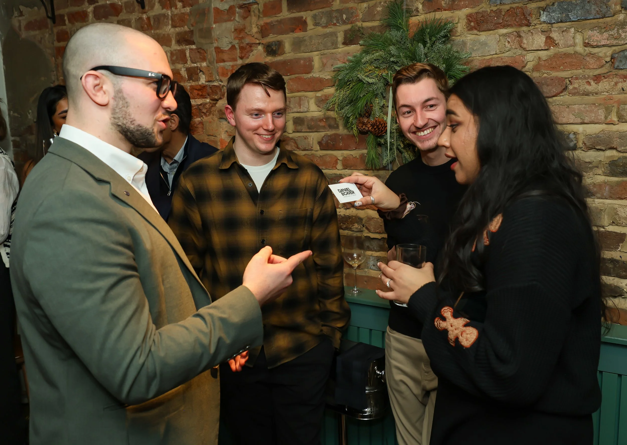 Intimate interactive magic entertaining guests with light-hearted moments and reactions.