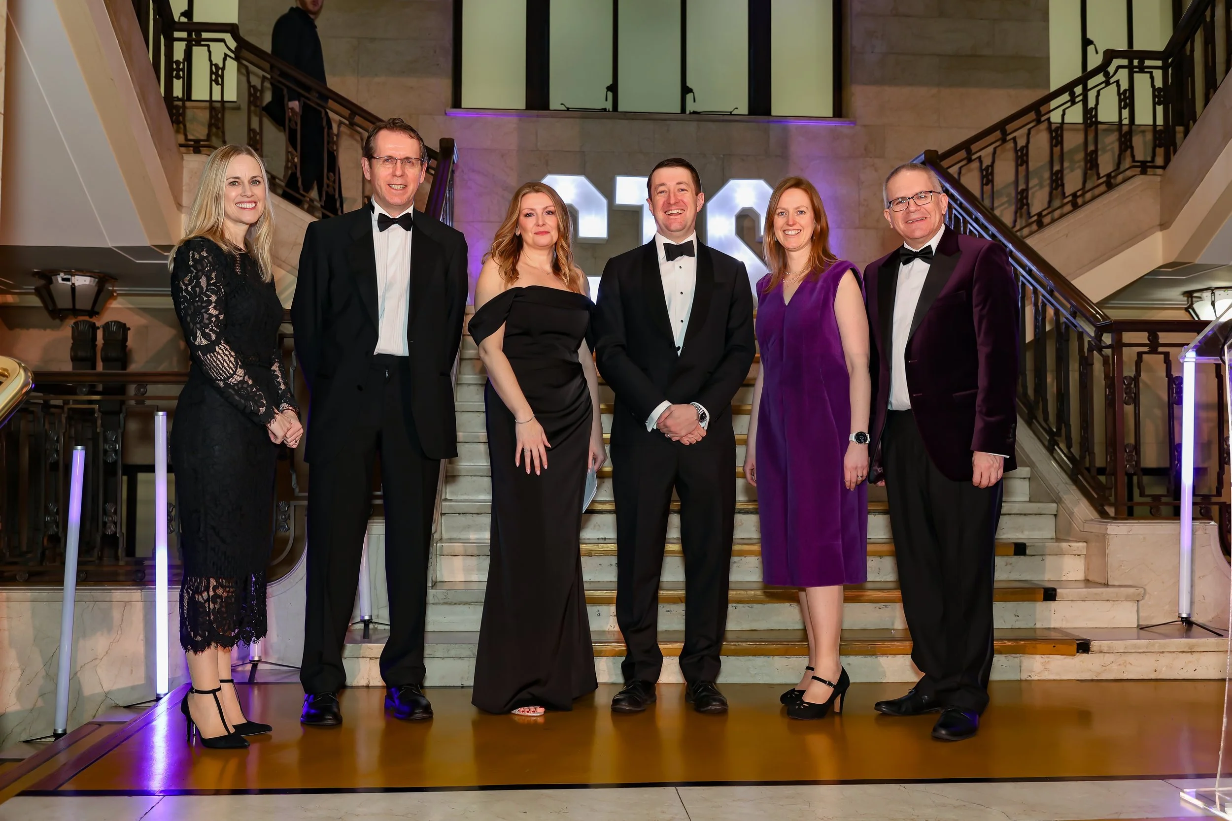 Corporate officials pose before the event starts. 