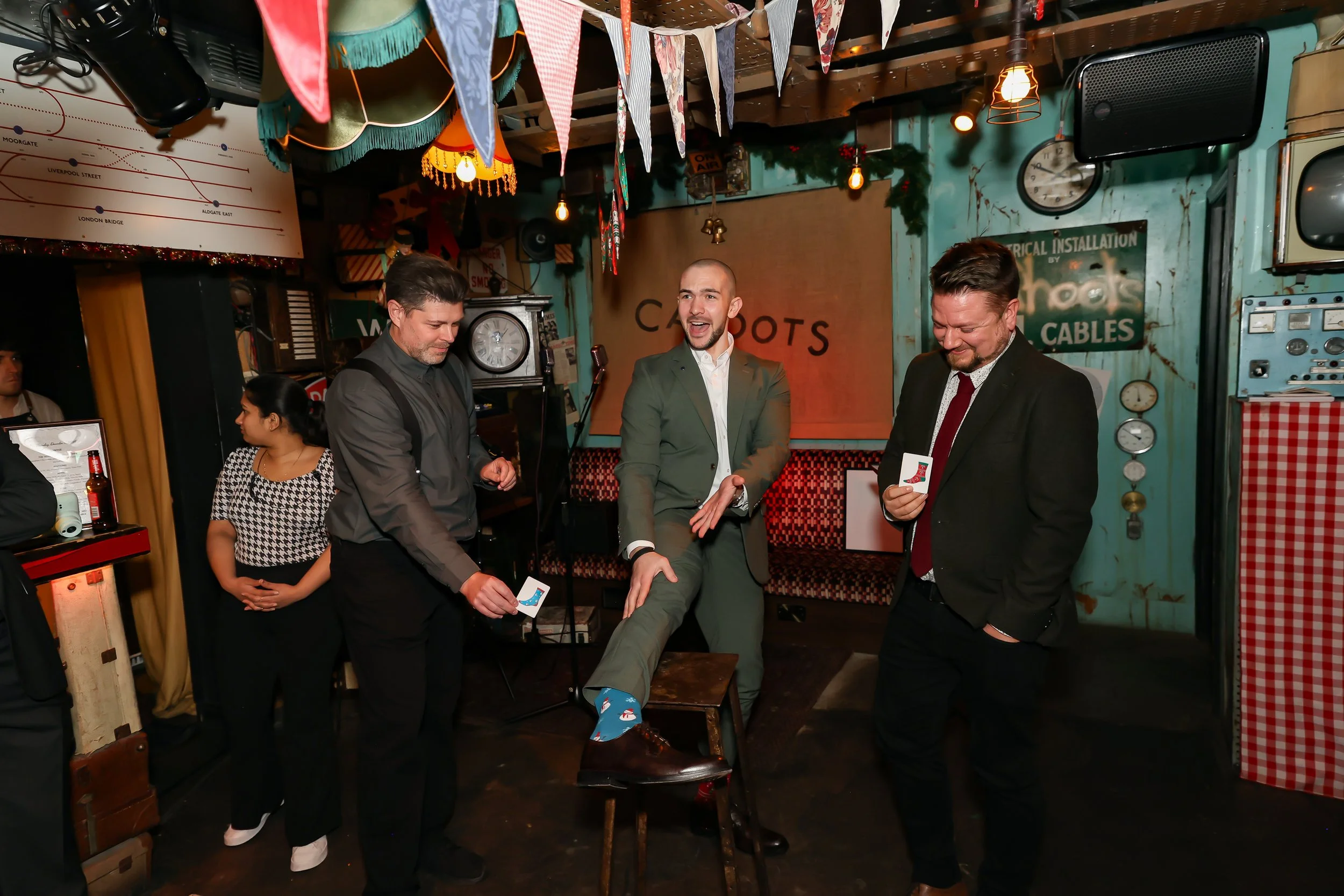 Magician performing walk-around magic for guests at reception.
